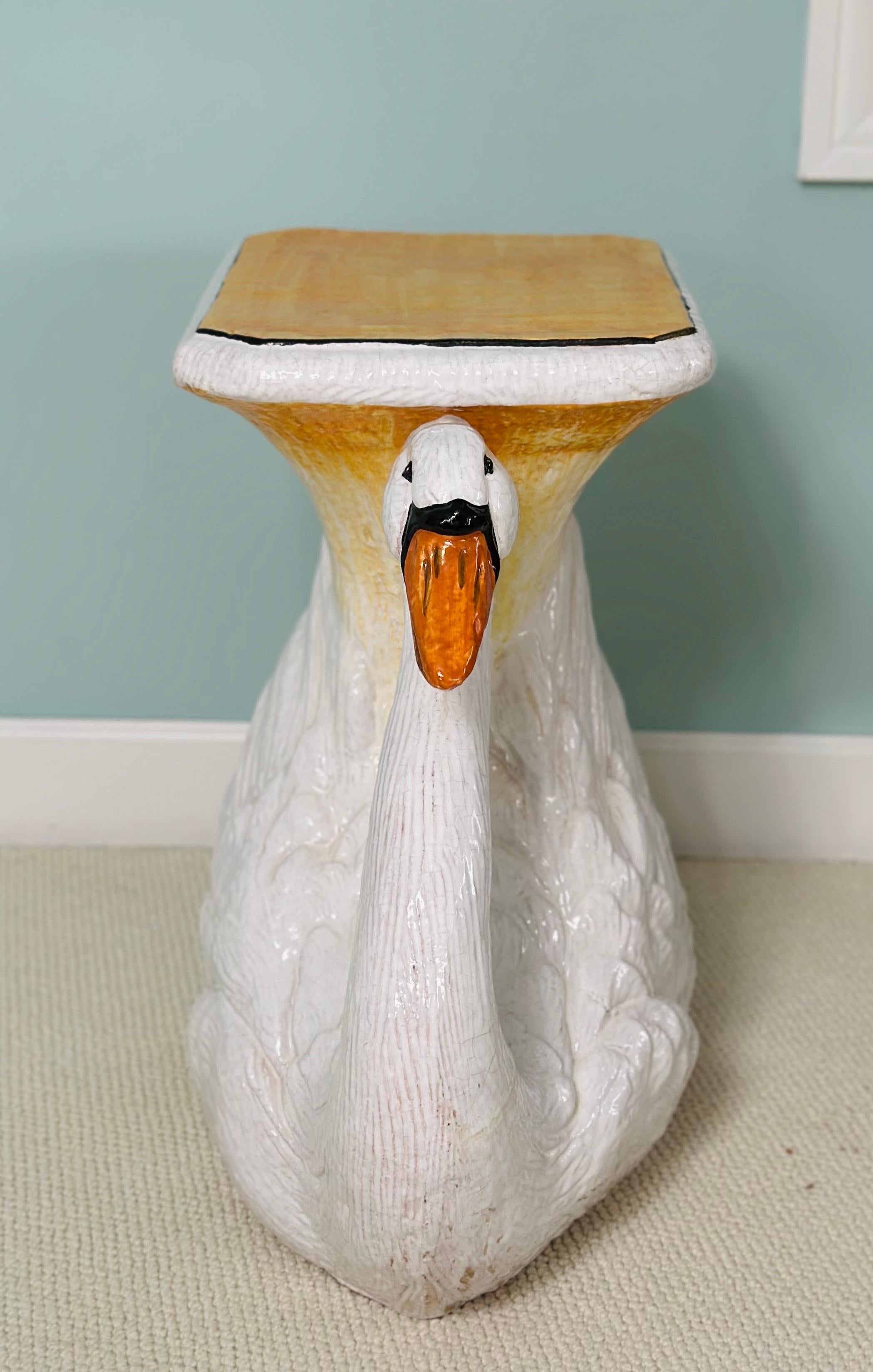 We are very pleased to offer a charming Italian glazed terracotta garden stool, circa the 1980s.  This lifelike swan will bring whimsical beauty to any space and add a touch of playful elegance to gardens, patios, or cozy interiors, making a