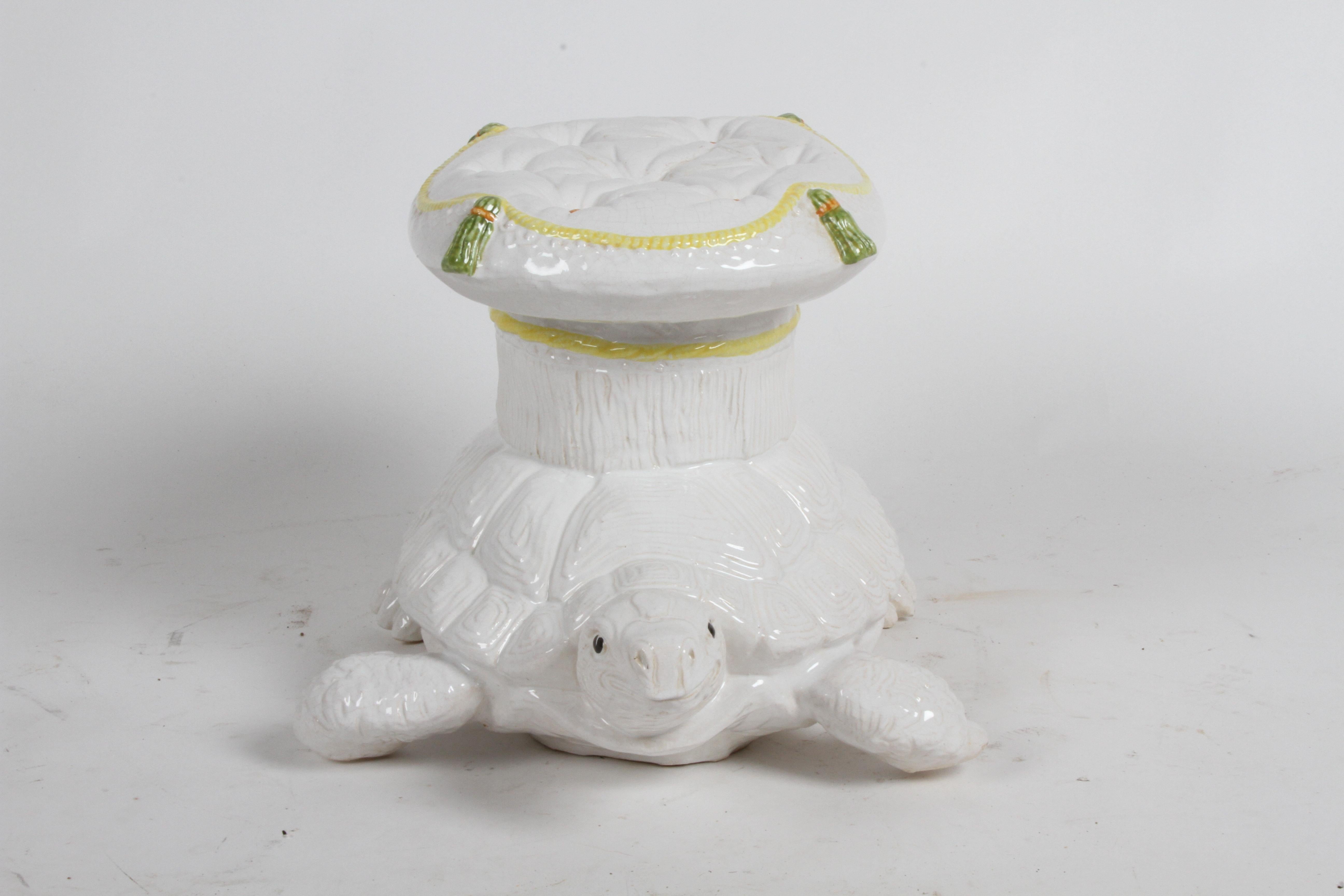 Large vintage Italian hand painted garden seat in the shape of a turtle with tufted pillow top, in white glazed ceramic, pillow having details of tassels, buttons and rope edge in yellow, orange and green. In very fine condition, from one estate,