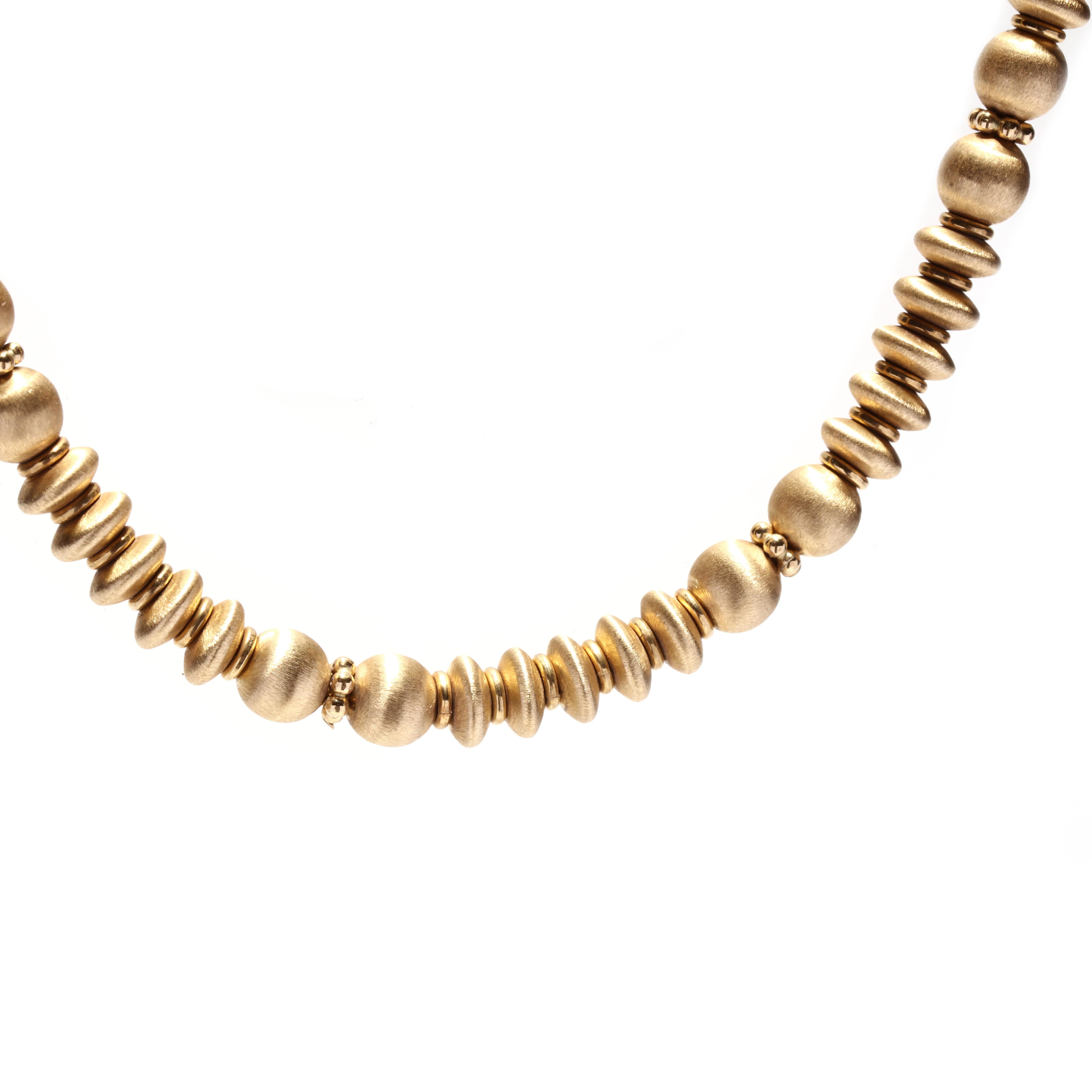 A vintage Italian 18 karat yellow gold Italian bead necklace. This necklace is comprised of brushed gold round and rondelle shaped beads, has a ball closure, and is marked 750 *1652 VI. 

Length: 17.5 in.

Width: 6 mm

Weight: 27.5 dwts. / 42.7