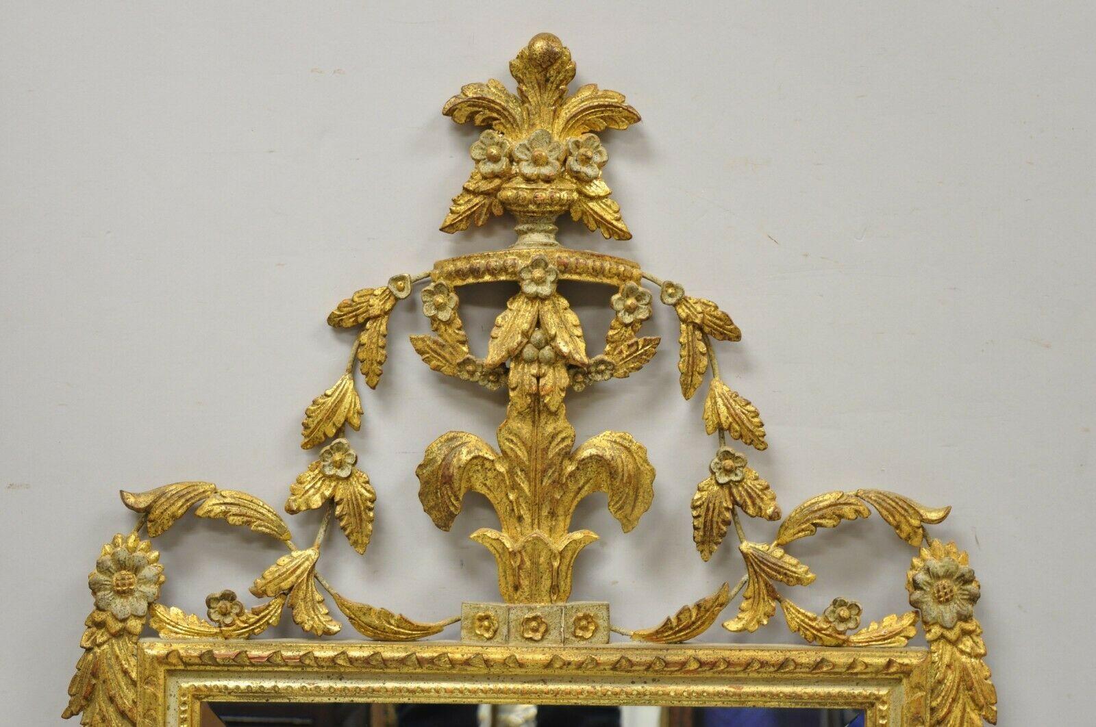 Vintage Italian gold giltwood carved wood leafy scrollwork console wall mirror. Item features carved wood leafy scrollwork, carved floral accents, gold gilt finish, very nice vintage item, quality Italian craftsmanship, great style and form. Circa