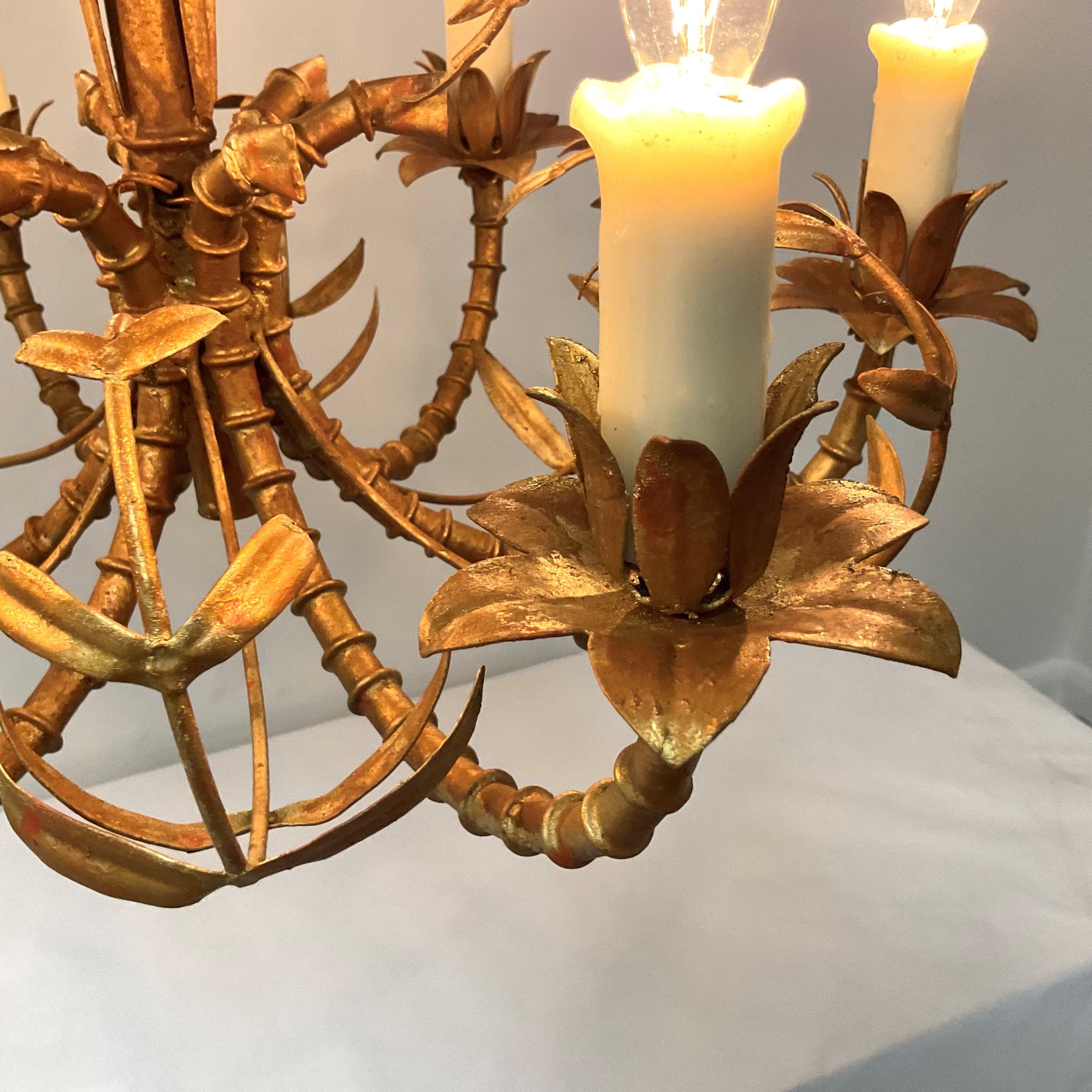 Vintage Gold Leaf Italian Metal Palm Chandelier. Meticulously made in the 1950s. Rich patinaed Gold Leaf finish completely rewired with new American candelabra sockets with natural beeswax candle covers.  3ft matching chain and canopy ready to