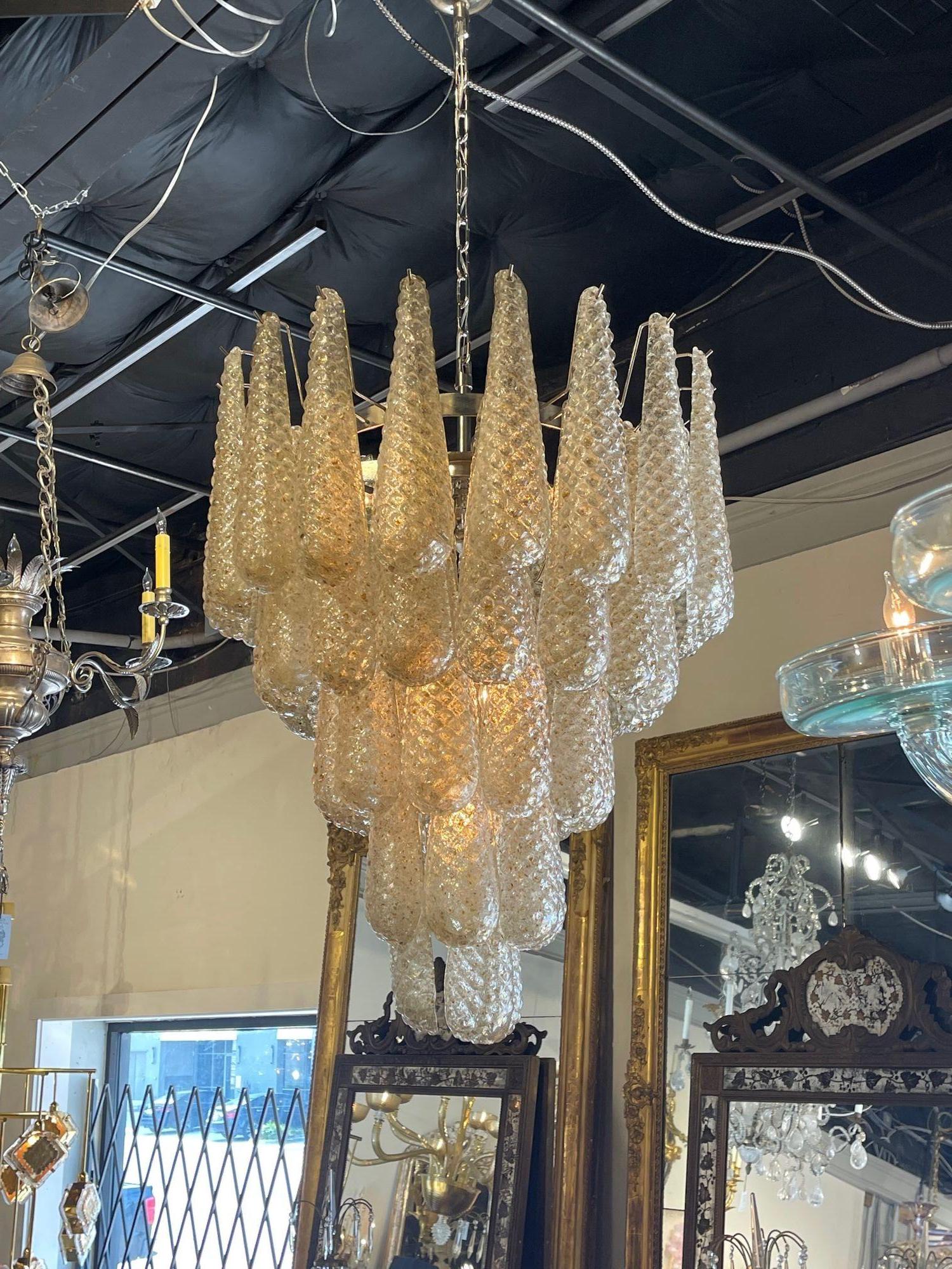 Beautiful vintage Italian gold Murano glass tear drop waterfall chandelier. Featuring gorgeous layers textured glass. Such a pretty fixture that could go modern or traditional. Outstanding!!