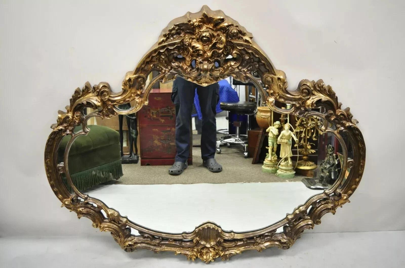 Vintage Italian Gothic Baroque Style Gold Hollywood Regency Large Wall Mirror. Item features a molded foam ornate frame, large impressive size, distressed gold finish, great style and form. Circa Late 20th Century. Measurements: 50