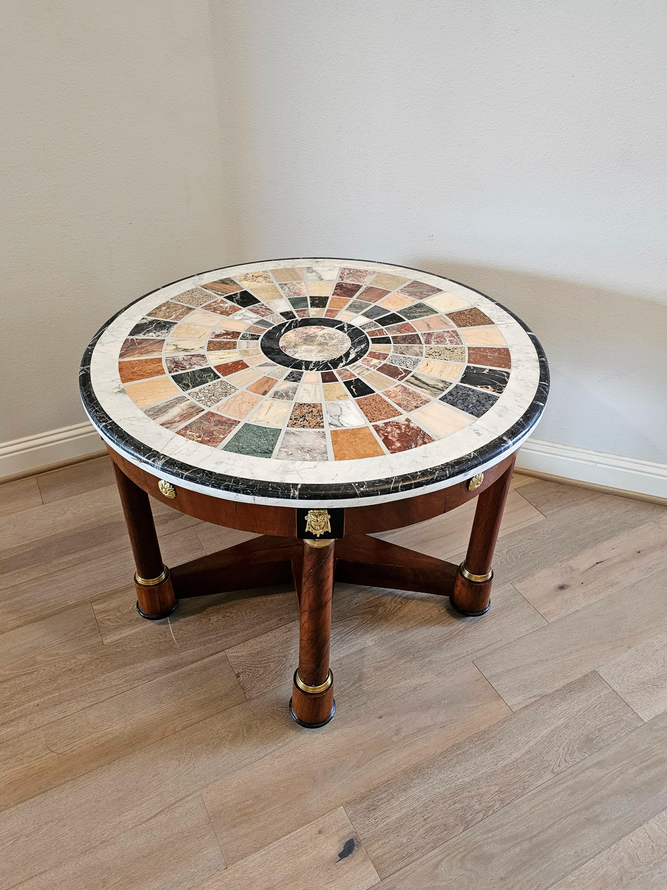 A stunning vintage Italian Empire Grand Tour style specimen marble 'pietra dura' table.

Topped with a spectacular exhibition quality round specimen marble slab, featuring a large variety of rare, exotic, and decorative marbles, hard stones,