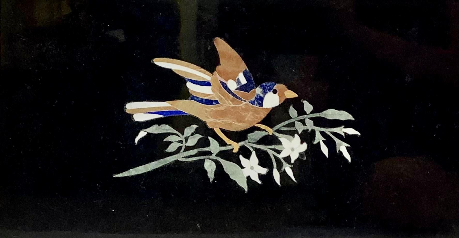 A Beautiful Italian grand tour style pietra dura mosaic on marble plaque with gilt framing. Picture is a bird on branch with leaves and flowers.