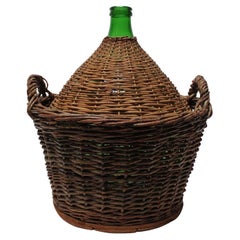 Demijohn italien vintage en verre vert avec panier en osier par Villani