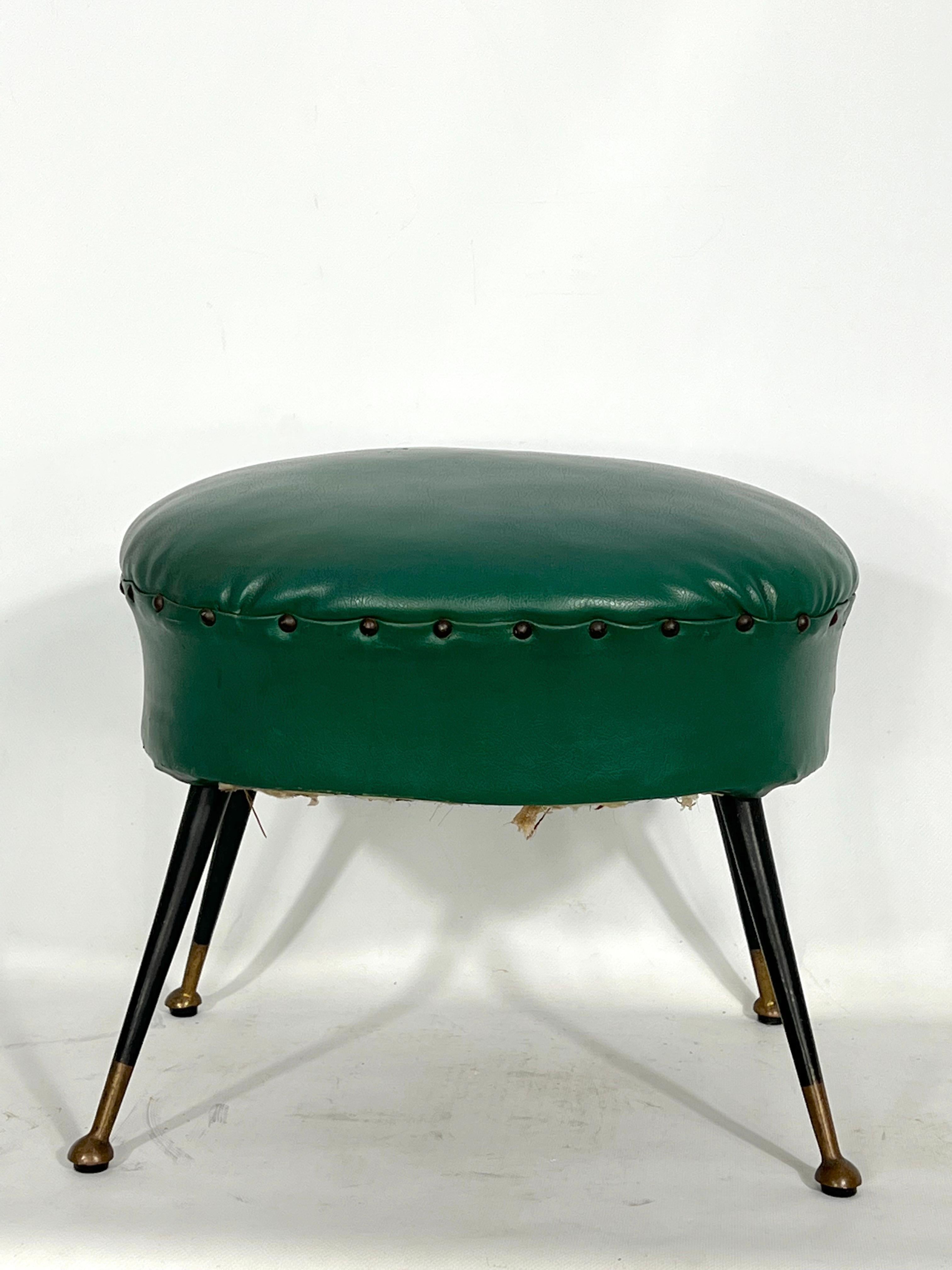 Original vintage condition with trace of age and use for this Italian green leatherette pouf with brass feet. Produced in Italy during the 50s.
