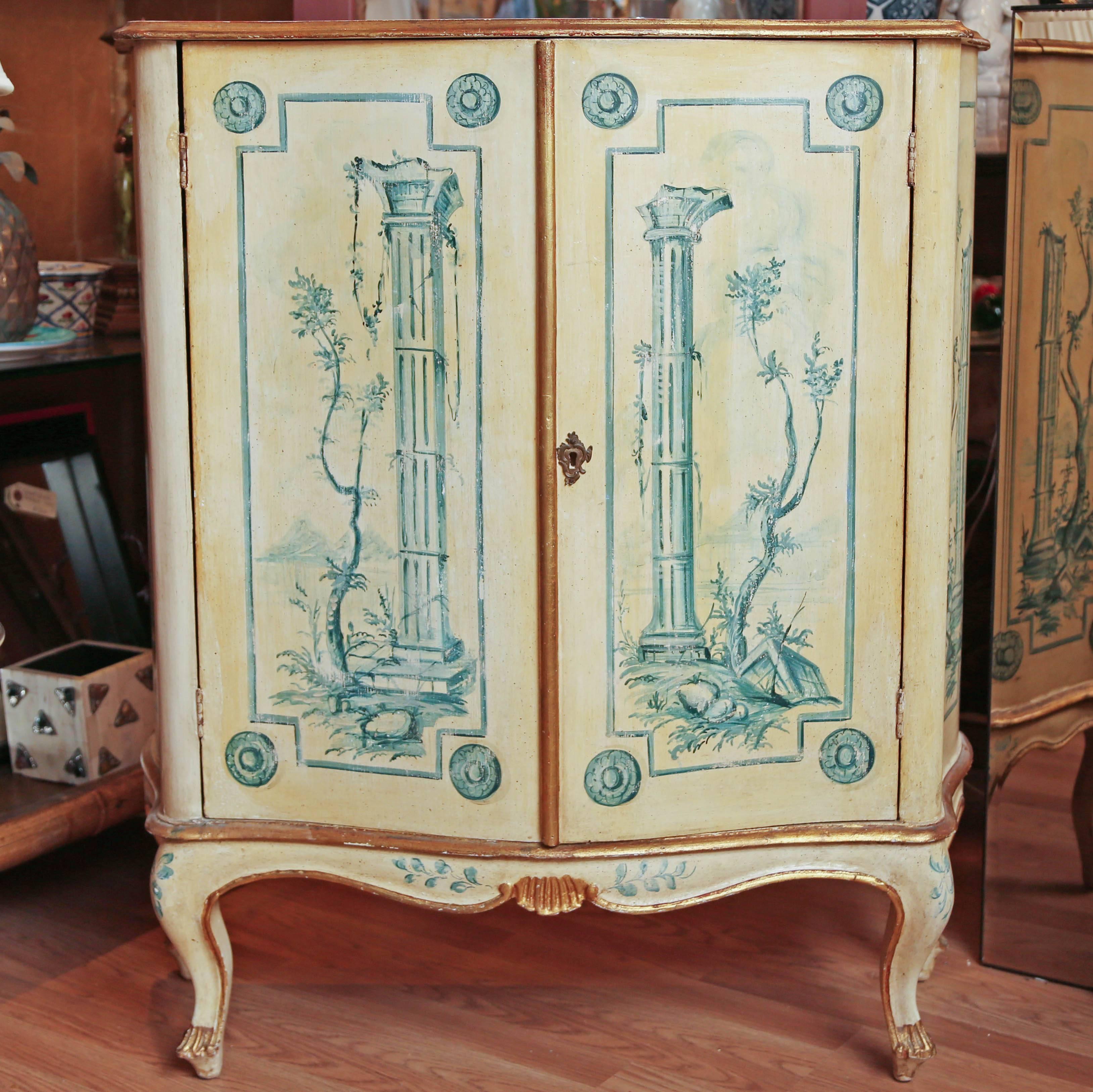 Vintage Italian hand-painted cream and blue two-door bar cabinet. Top lifts up to reveal additional storage.