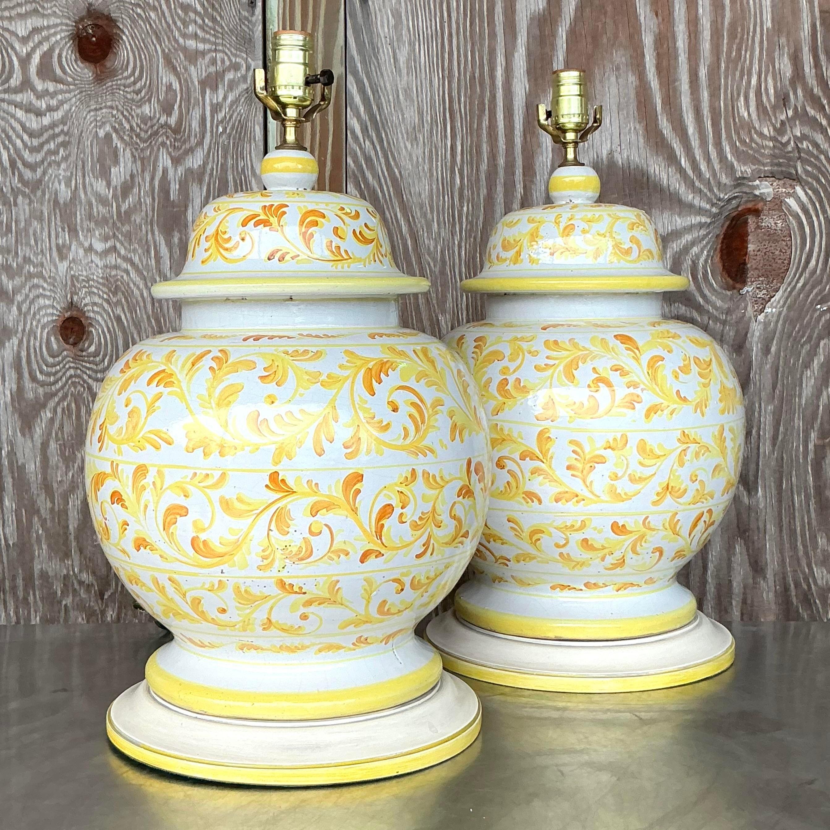 A stunning pair of vintage Italian hand-painted ceramic lamps, featuring intricate designs and vibrant colors. Perfect for adding a touch of Mediterranean charm to any room.
