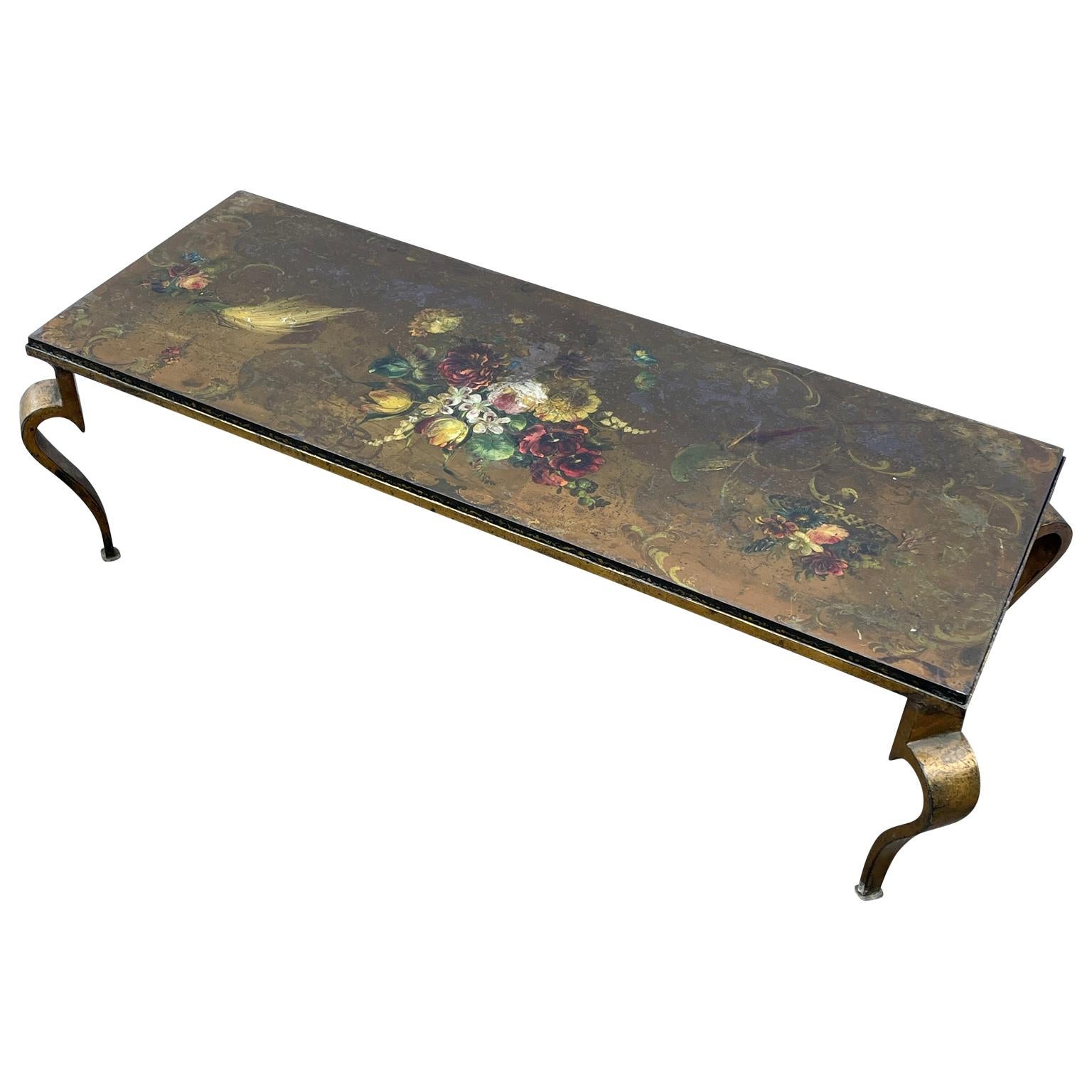 An amazing and rare hand-painted thick slate top and rectangular gilt patinated iron cocktail table, vintage Mid-20th Century Italy.
The vintage 1 inch thick slate top has beautiful hand-painted decorations of birds and flowers.

