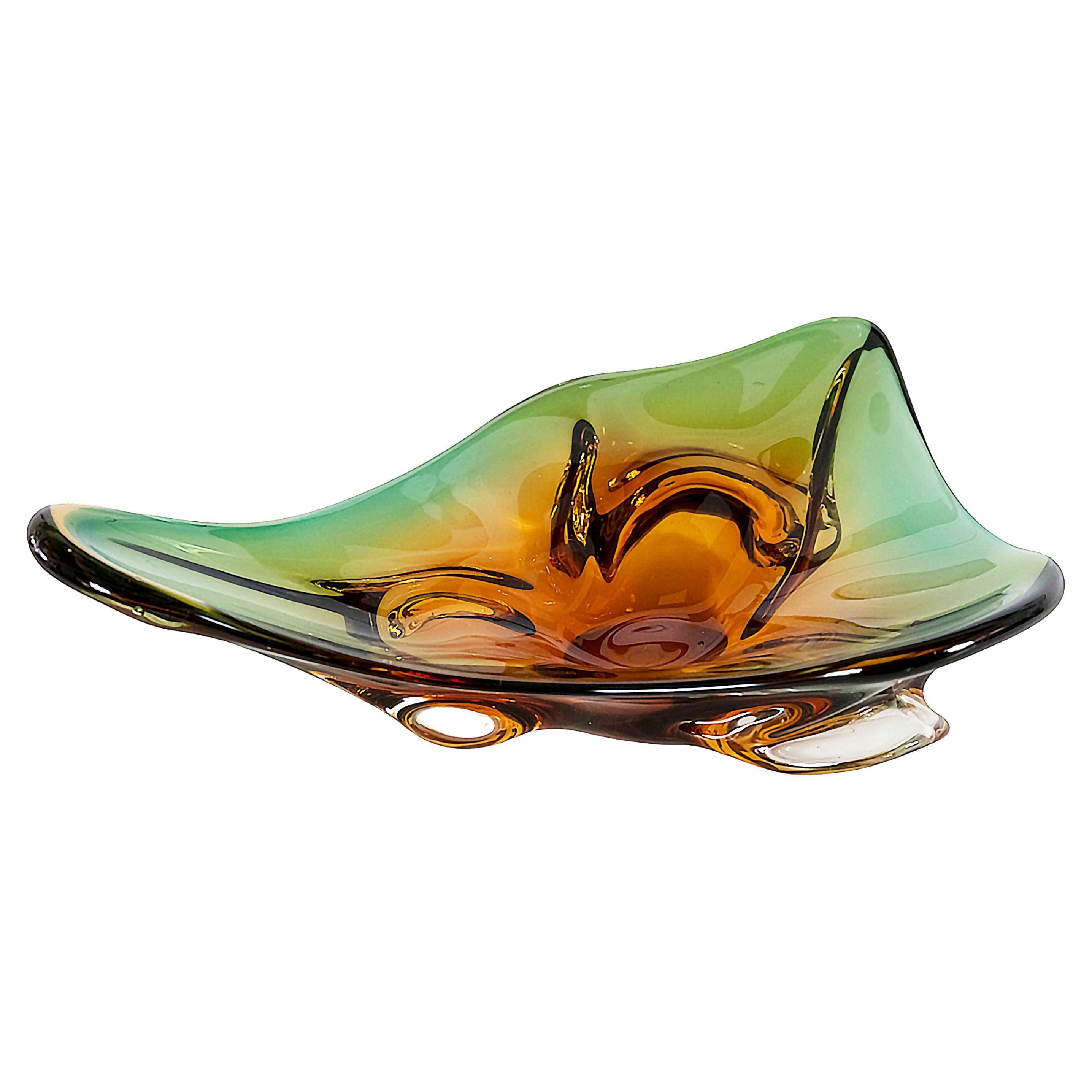 Vintage Italian handmade Murano glass vase / centerpiece in asymmetric shape.
The glass is yellow/orange/green colors.
Heavy and solid.
Very good/excellent condition.
