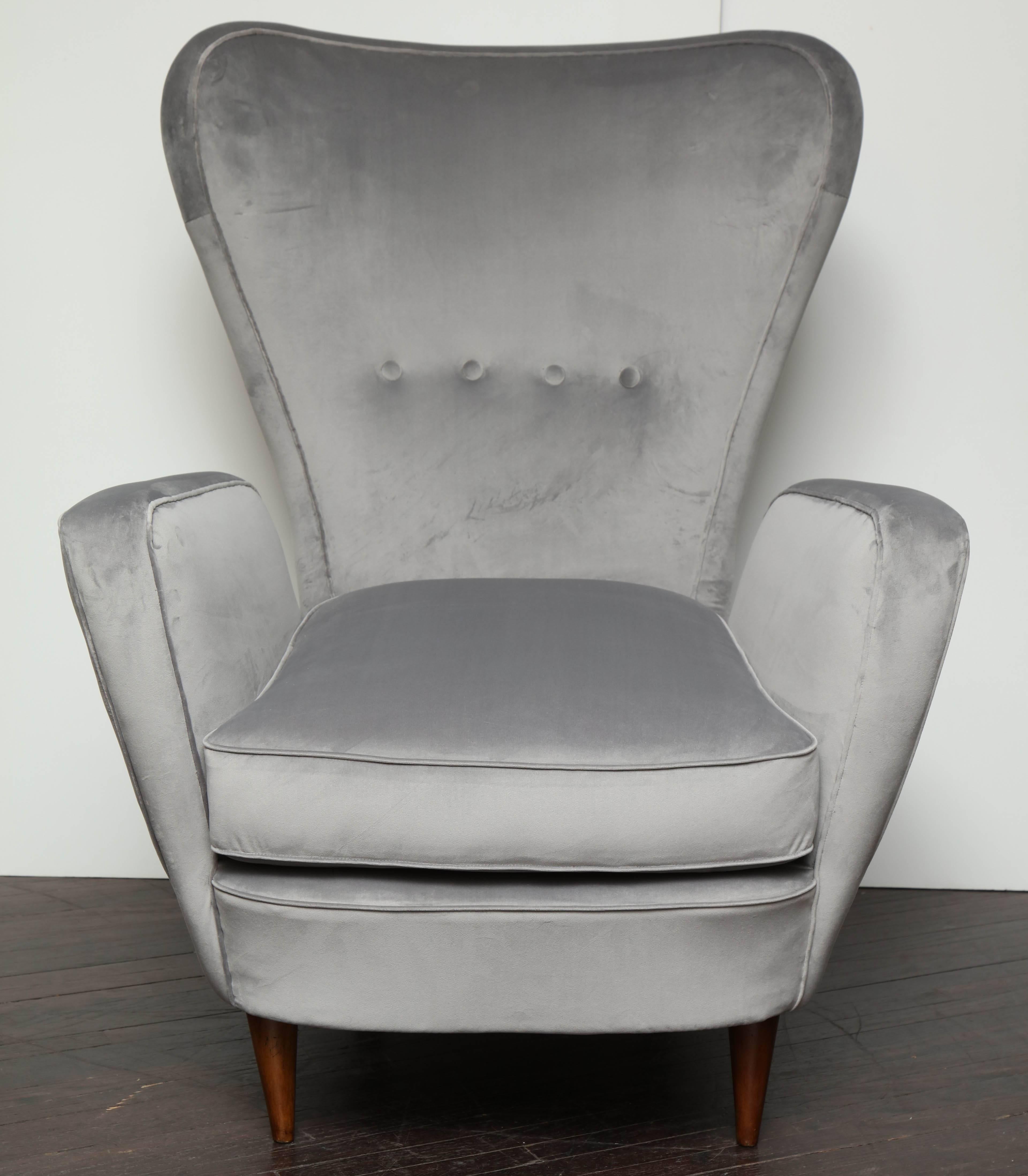 A single vintage Italian high back chair in silver velvet. The chair has unique Gio Ponti like curvature lines and tufted backrest. All the upholstery is brand new.