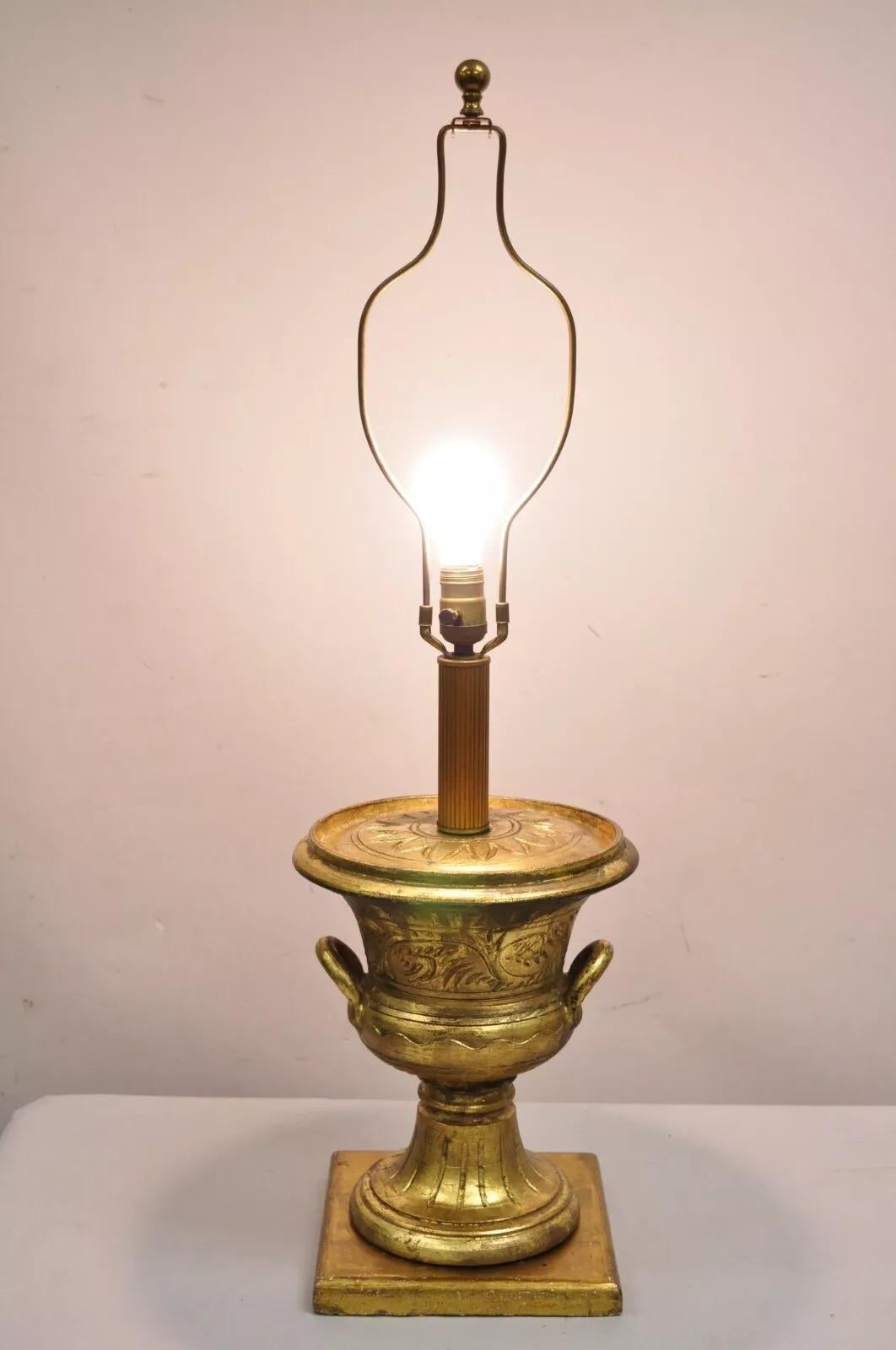 Vintage Italian Hollywood Regency Ceramic Distressed Gold Finish Twin Handle Urn Form Table Lamp. Circa Mid 20th Century. Measurements: 35.5