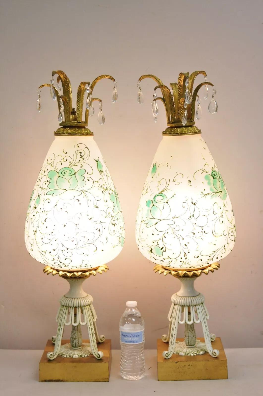 Vintage Italian Hollywood Regency Glass Pineapple Gold Metal Table Lamps - a Pair. Item features shapely glass bodies with green floral painted design, gold gilt metal base, and tall shapely form. Circa Mid 20th Century. Measurements: 31