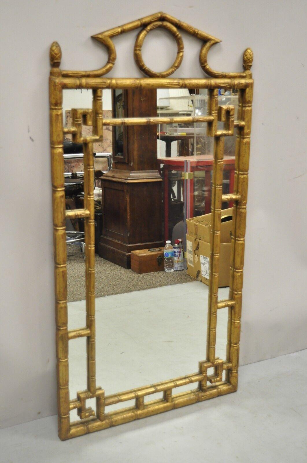 Vintage Italian Hollywood Regency gold giltwood faux bamboo pagoda wall mirror. Item features carved wood faux bamboo frame, original label, very nice vintage item, quality Italian craftsmanship, great style and form. Circa mid 20th century.