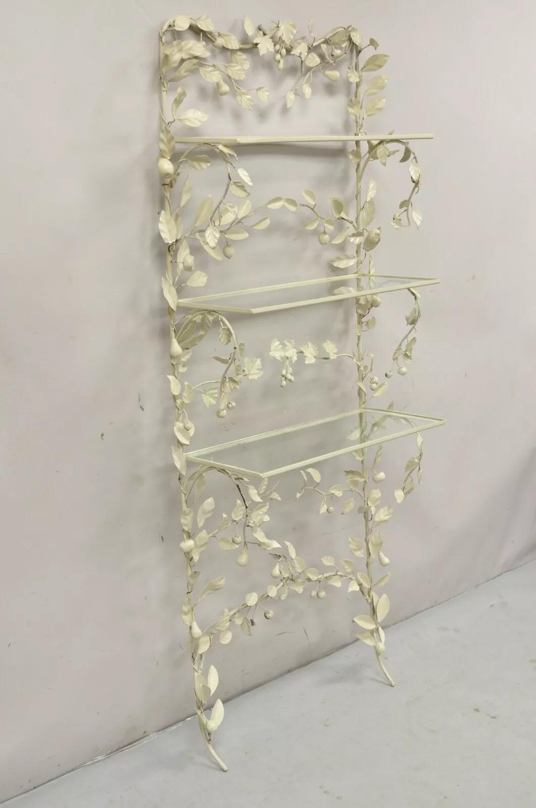 Vintage Italian Hollywood Regency Iron Tole Metal Fruit Vine Wall Hanging Shelf. Item features 3 glass shelves, maple leaf and fruit vine cream/white painted iron frame, very nice vintage wall mounted shelf. Circa  Mid 20th Century. Measurements: