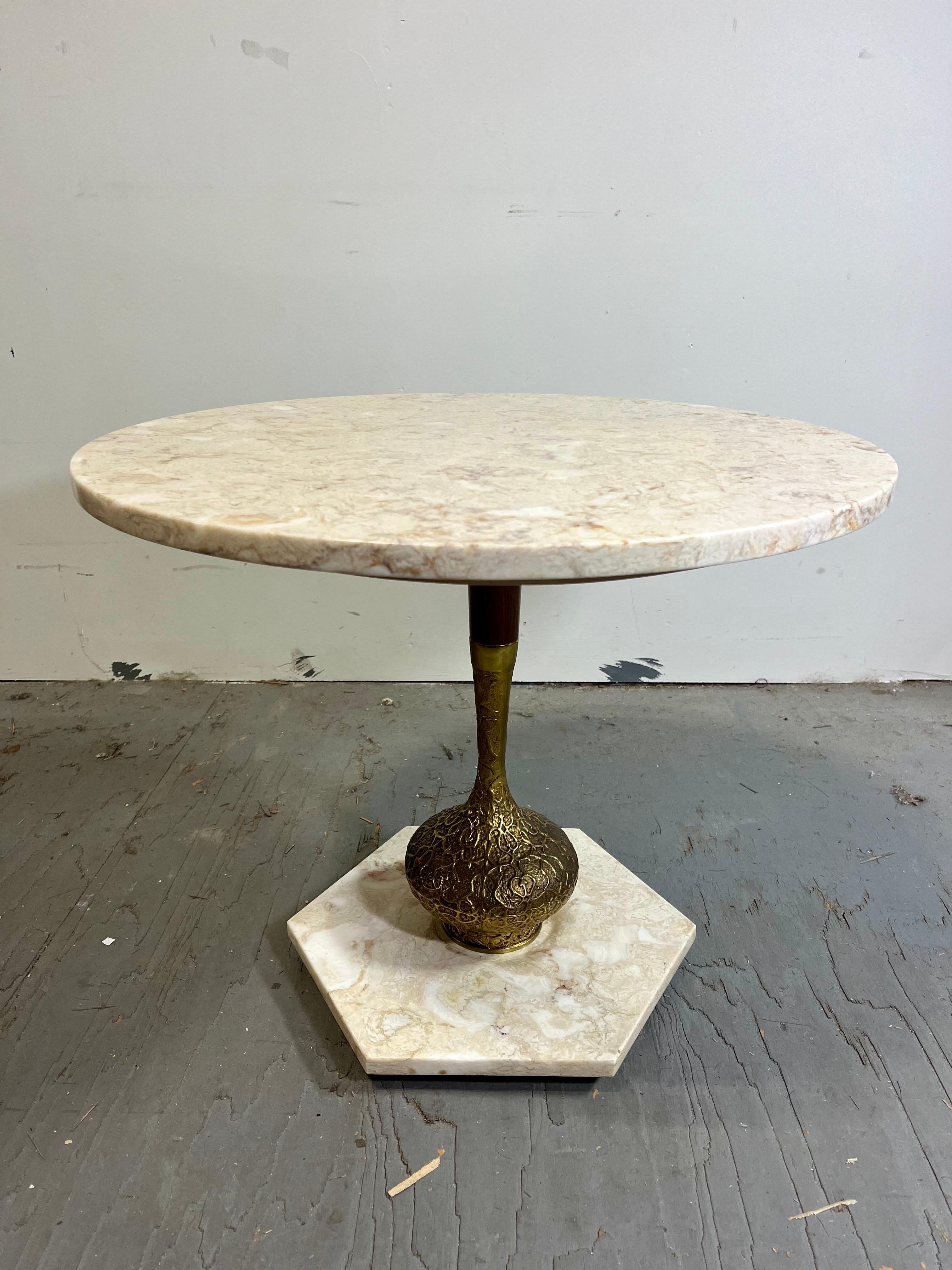 Vintage Italian Hollywood Regency marble top brass vase coffee table. Item features large circular marble top, marble base, and brass metal vase pedestal, clean modernist lines, great style and form, circa 1960s. 
Curbside to NYC/Philly $450