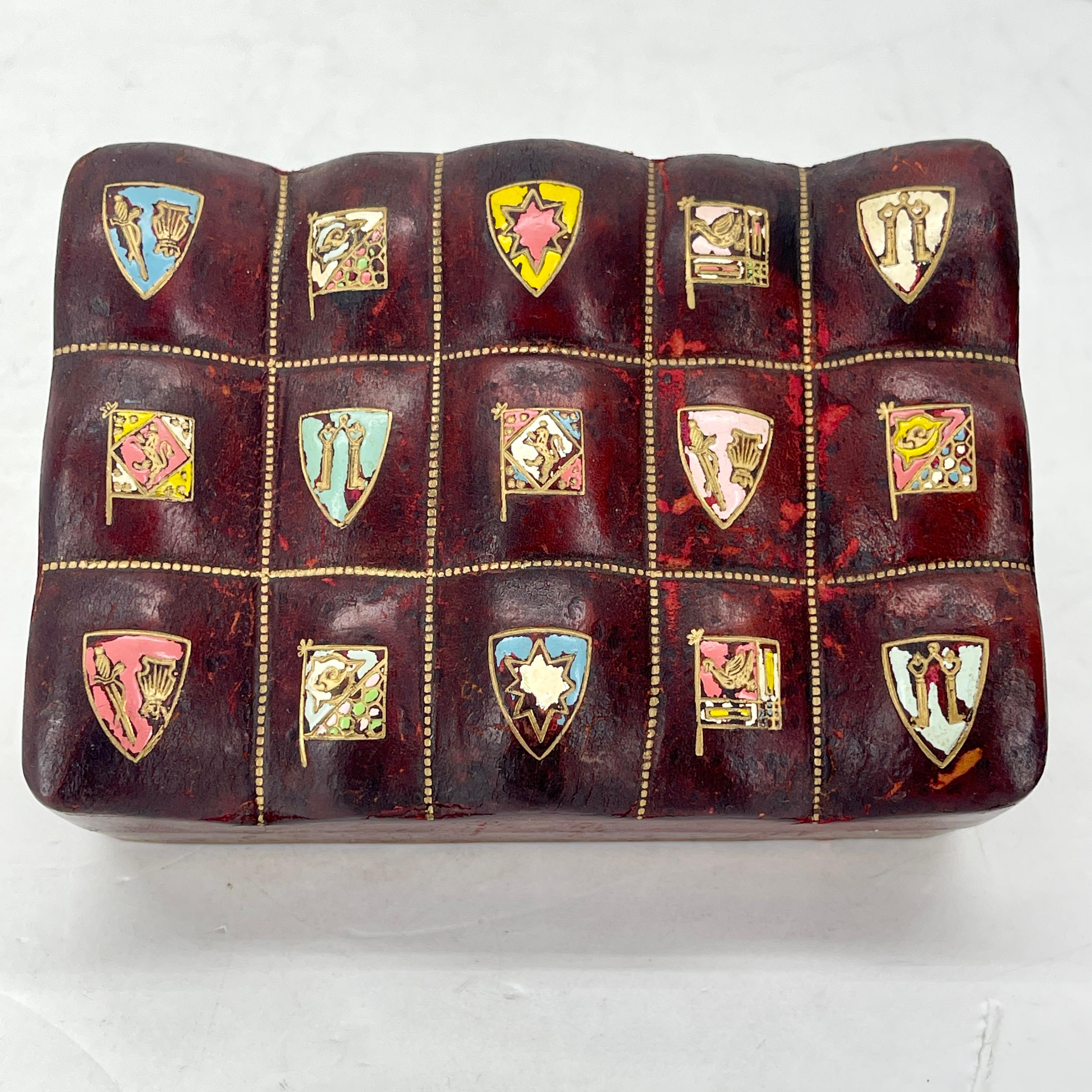 Amazing Rectangular Burgundy leather jewelry box with gold Embossing and Bevelled Lei With Multiple Code of Arms. Signed / Marked Made in Italy and Genuine Leather.
