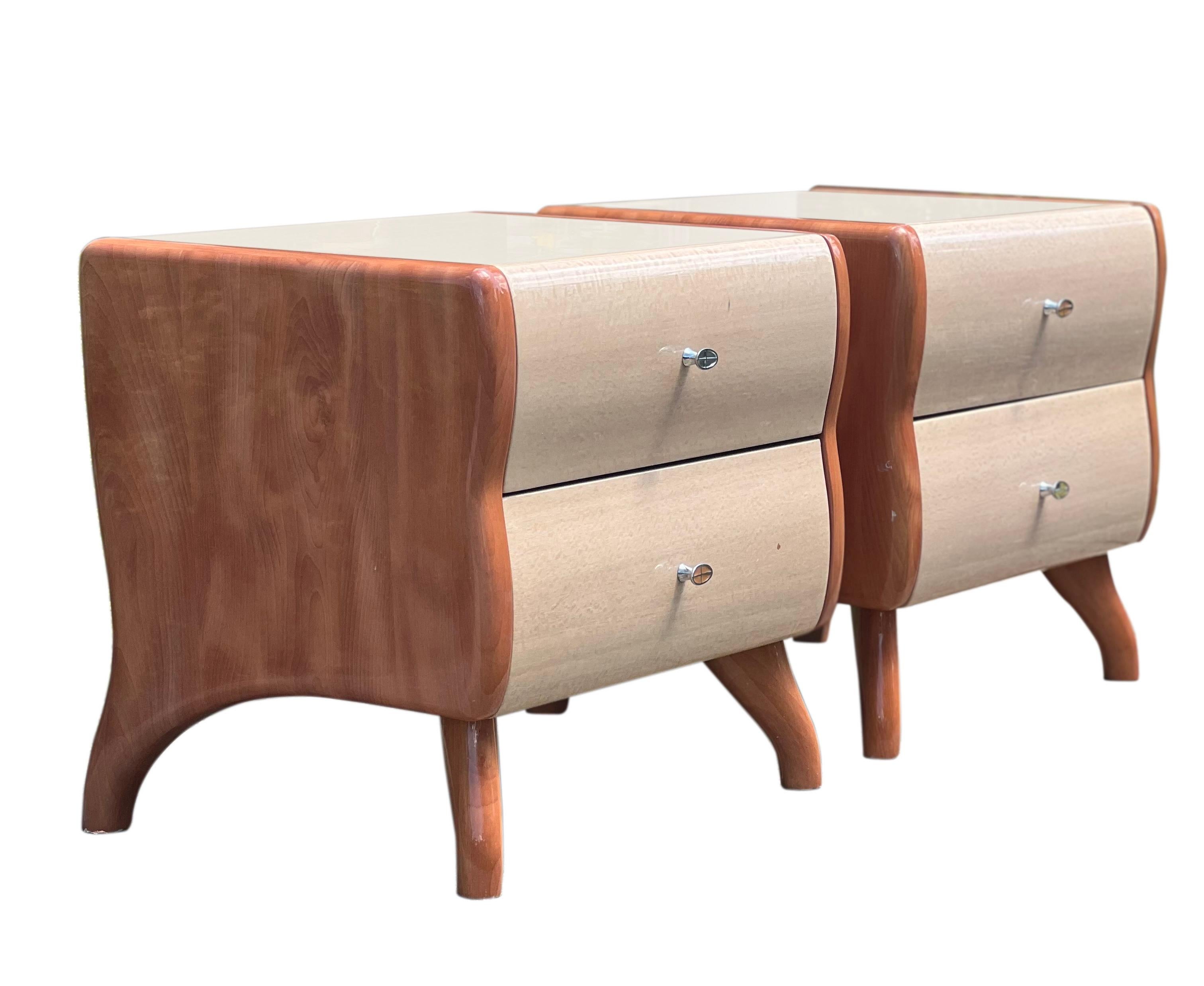 Fabulous pair of Italian lacquered, two-tone nightstands.

Crafted of maple and birch woods, the sturdy stands boast a stunning silhouette in two tone. The high quality lacquer is used throughout the entire piece and is exceptionally protective.