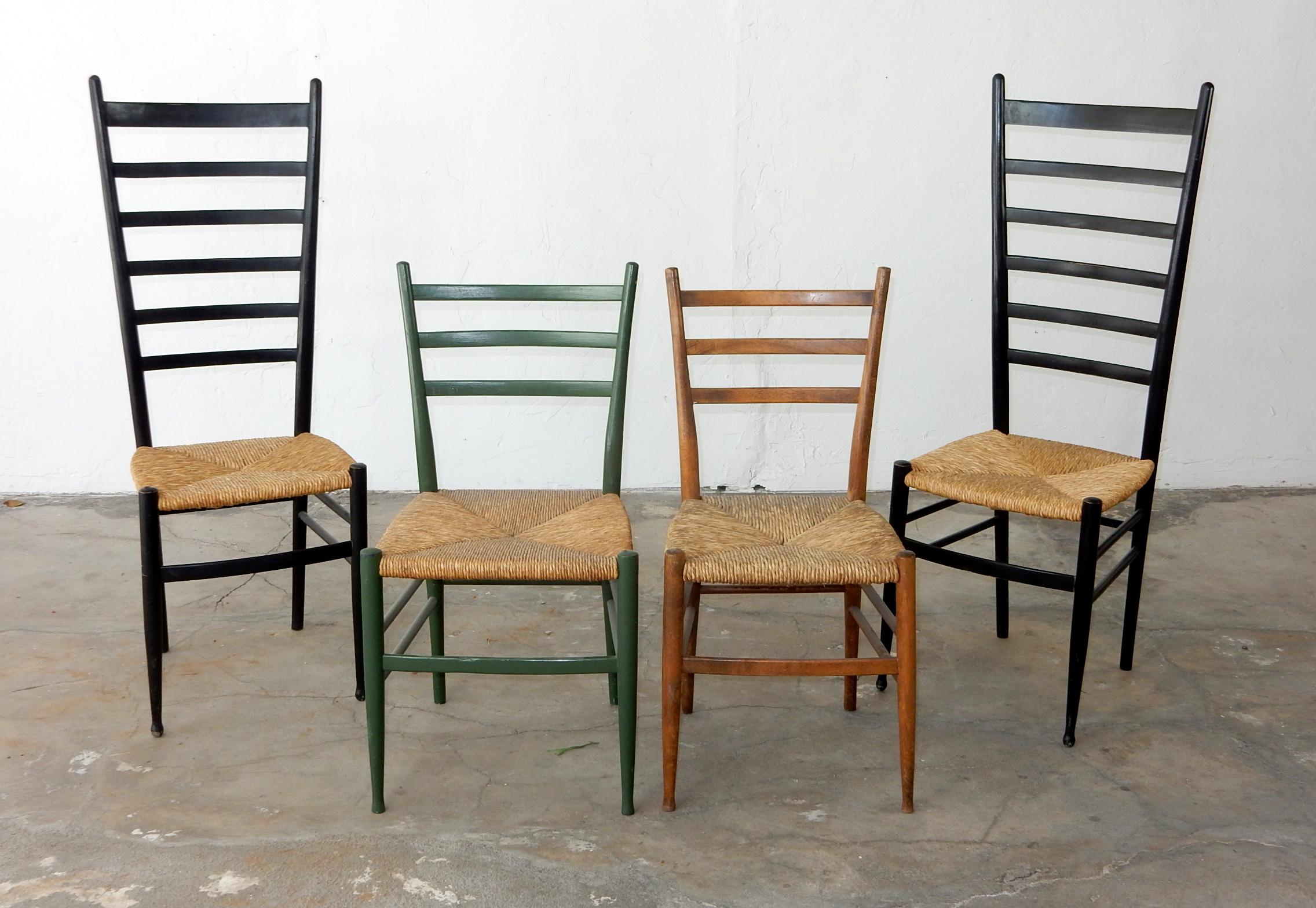 A nice set of 4 vintage 1950s Italian ladder back chairs with original rush seating.
Each signed Italy. One was painted green, 2 tall retain original negro finish, one is natural.
All is good condition. They stand 33-1/2 and 45-1/2 inches tall.
 