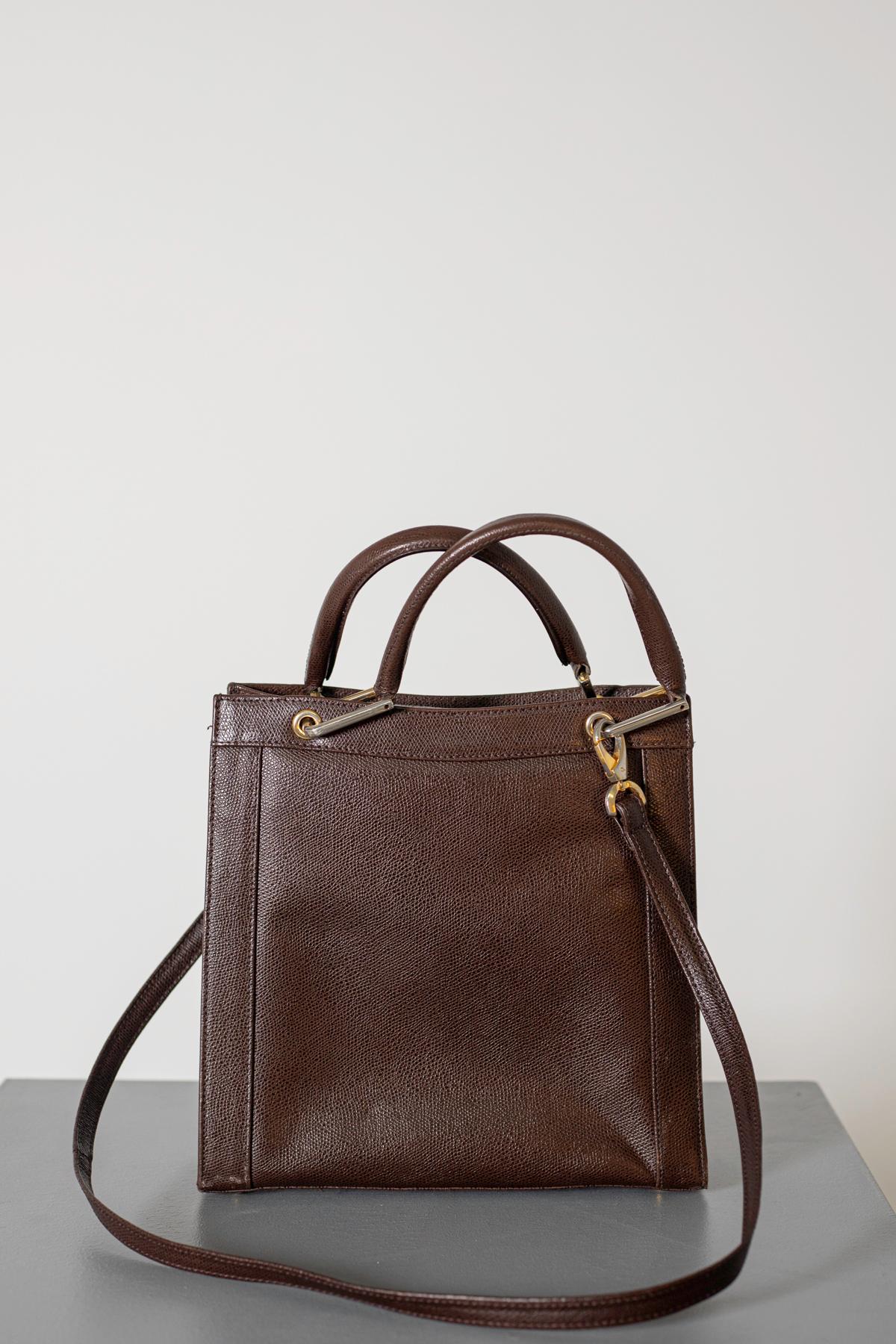 Lady italian Bag by Giorgia from 1950. Brown leather, flat leather strap, a single compartment on the underside of the front flap with magnetic snap closure. Combining great practicality and extraordinary appearance, Giorgia is the ideal solution