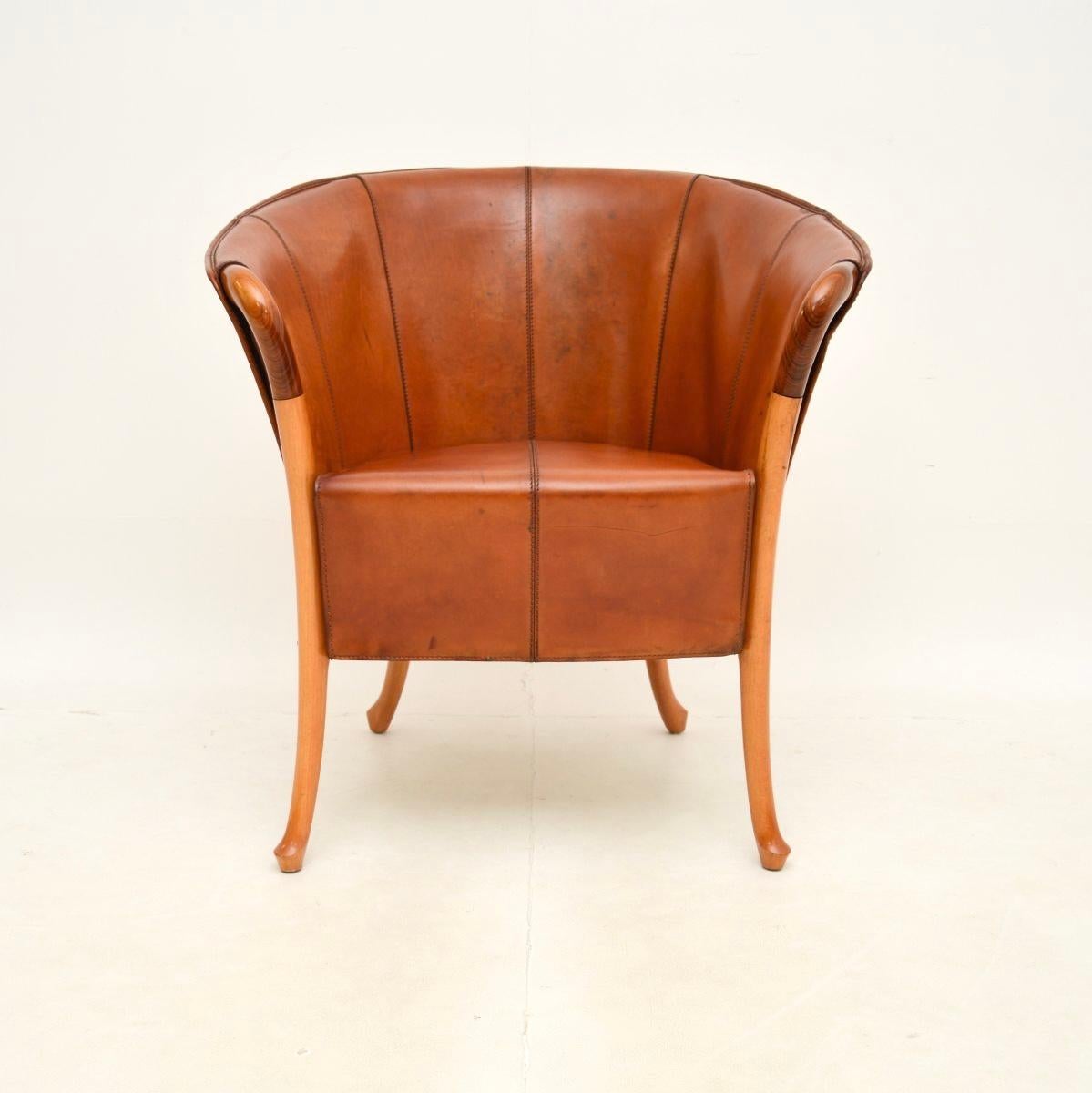 A stunning and extremely well made vintage Italian leather armchair by Georgetti Progetti. This famous and beautiful design is by Umberto Asnago, it dates from around the 1980’s.

The quality is outstanding, the frame is solid walnut and solid ash