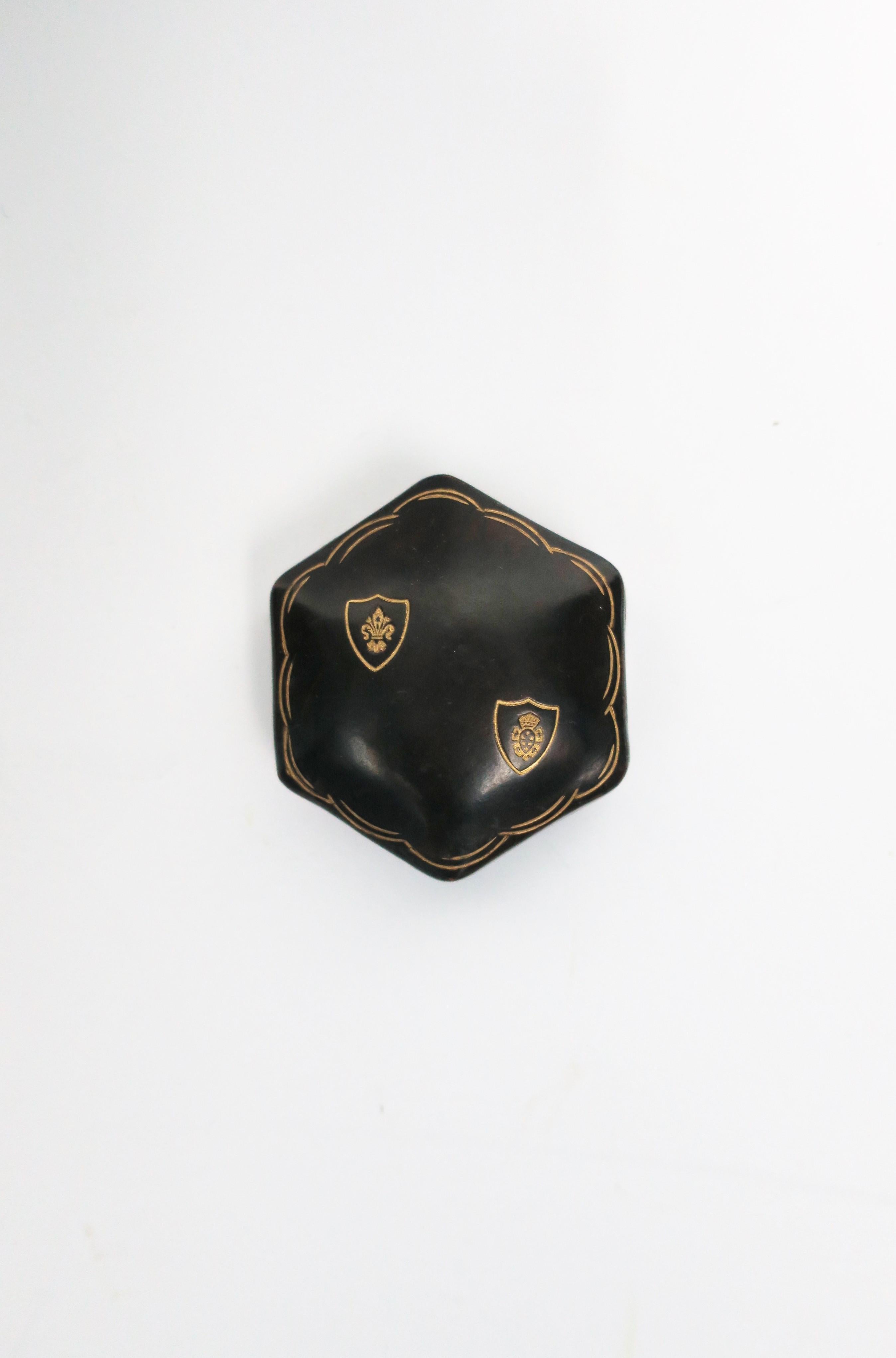 A vintage Italian dark brown leather jewelry box in an octagonal shape with gold embossing on top/lid, circa mid-20th century, Italy. Dimensions: 2.5