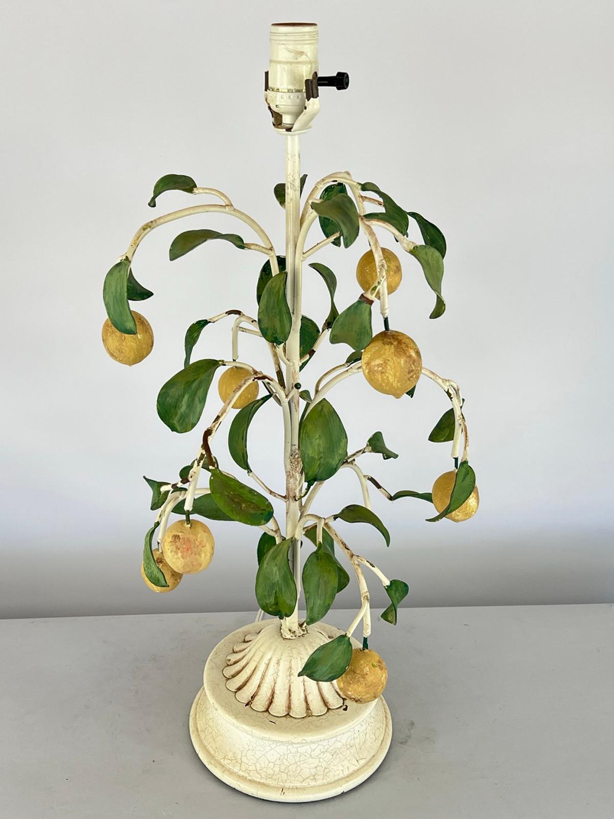 Vintage table lamp, of polychromed metal and composite, fashioned as a lemon tree with scrolling, foliate branches, lamped on round plinth. A matching finial is included. 

Stock ID: D3618.