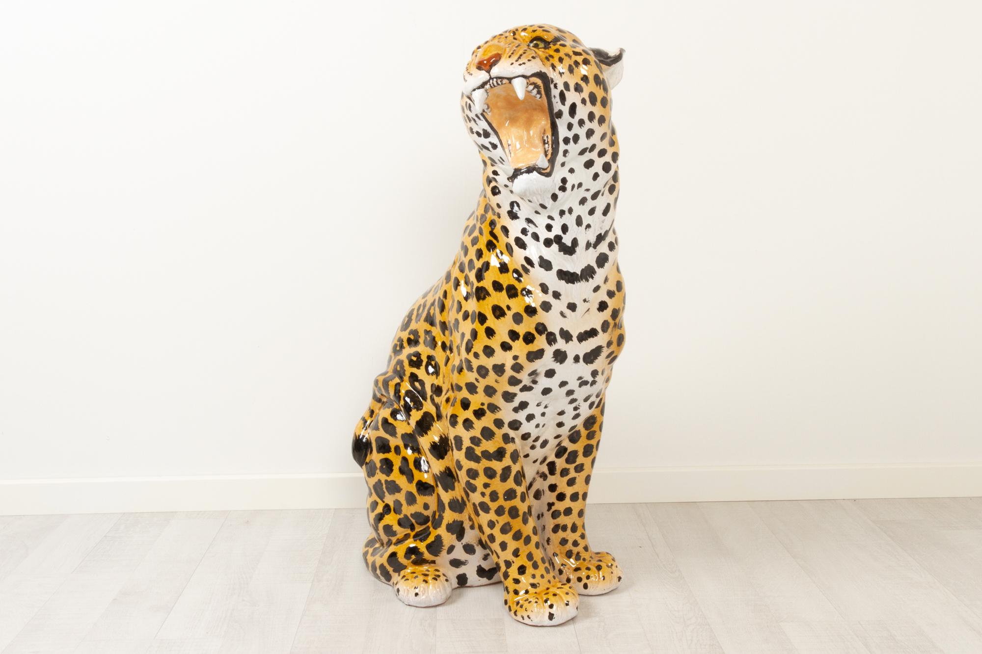 Vintage Italian life-size terracotta leopard, 1960s
A stunning large hand painted ceramic animal sculpture of a sitting Leopard. Life-size and anatomically correct big cat sculpture. Made in Italy in the sixties.
In excellent condition and marked