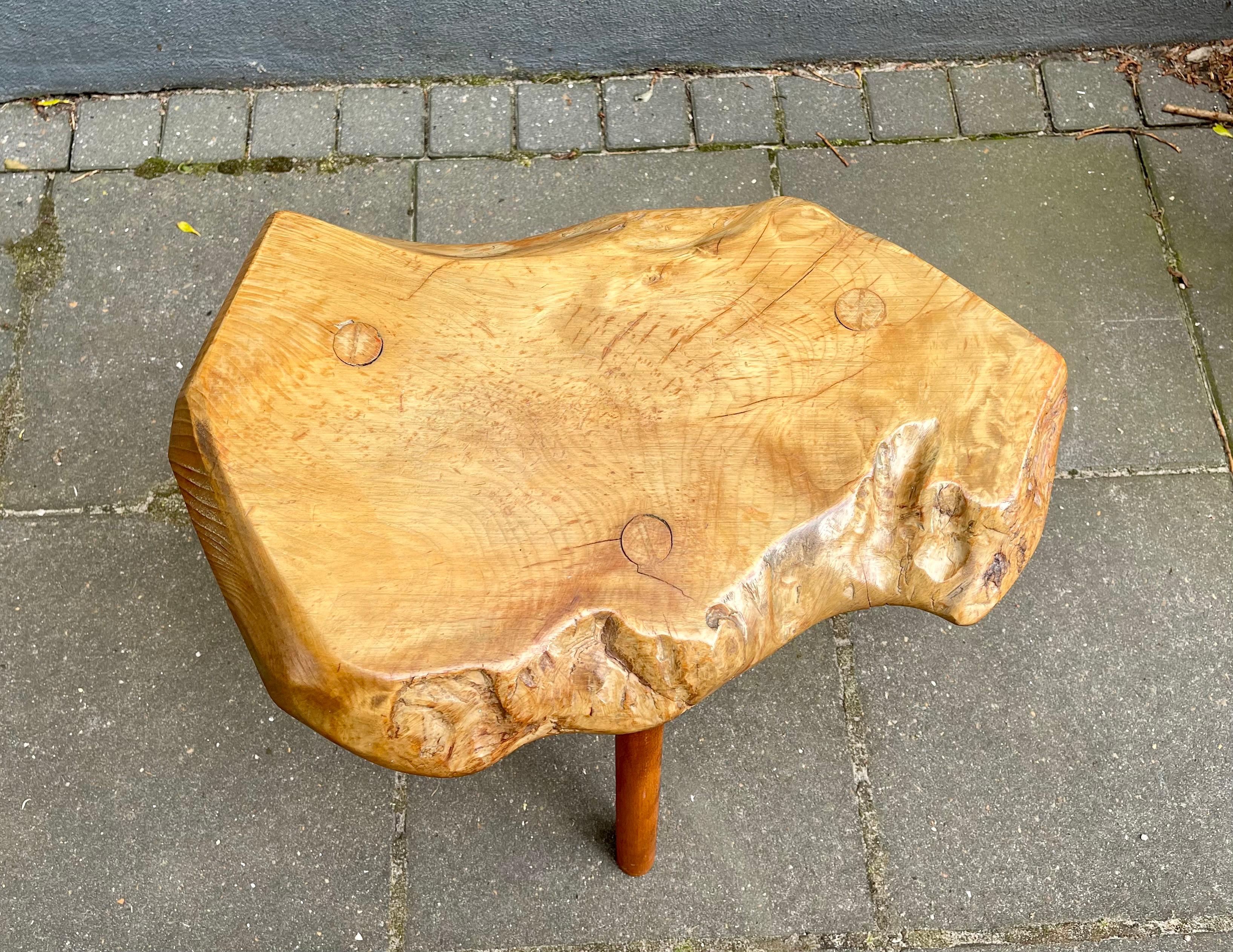 Unique organic modern lamp-, side table or stool fashioned from a live edge slab of Chestnut Oak. The 3 submerged/pertruding legs are made from Oregon pine. It was artisan made in Italy circa 1970-80. It appears it has been treated with oil at some