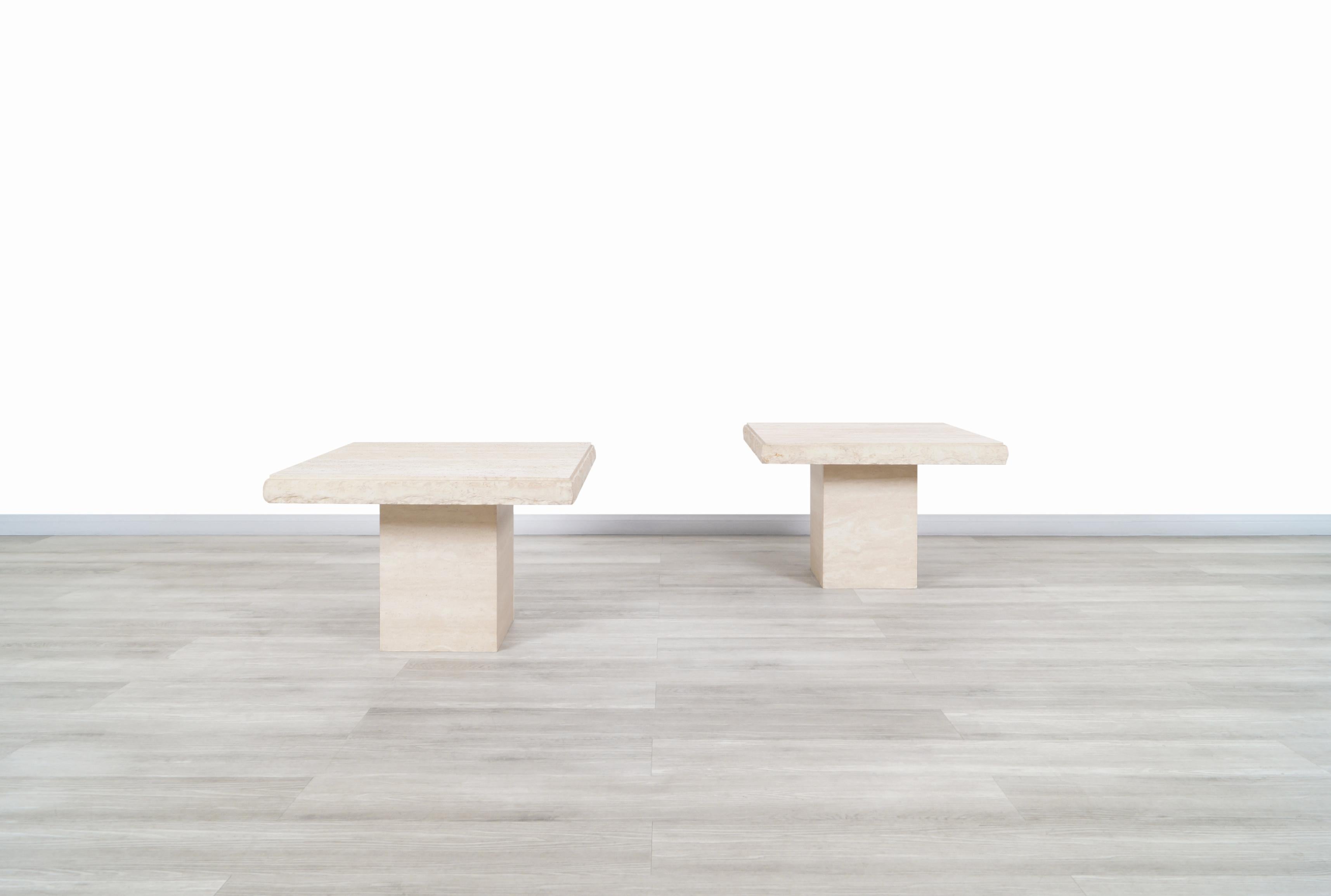 Wonderful vintage Italian travertine side tables designed and manufactured in Italy, circa 1970s. The modernist design is perfectly complemented by the natural minerals of the travertine stone. The tables feature a square travertine top with a live