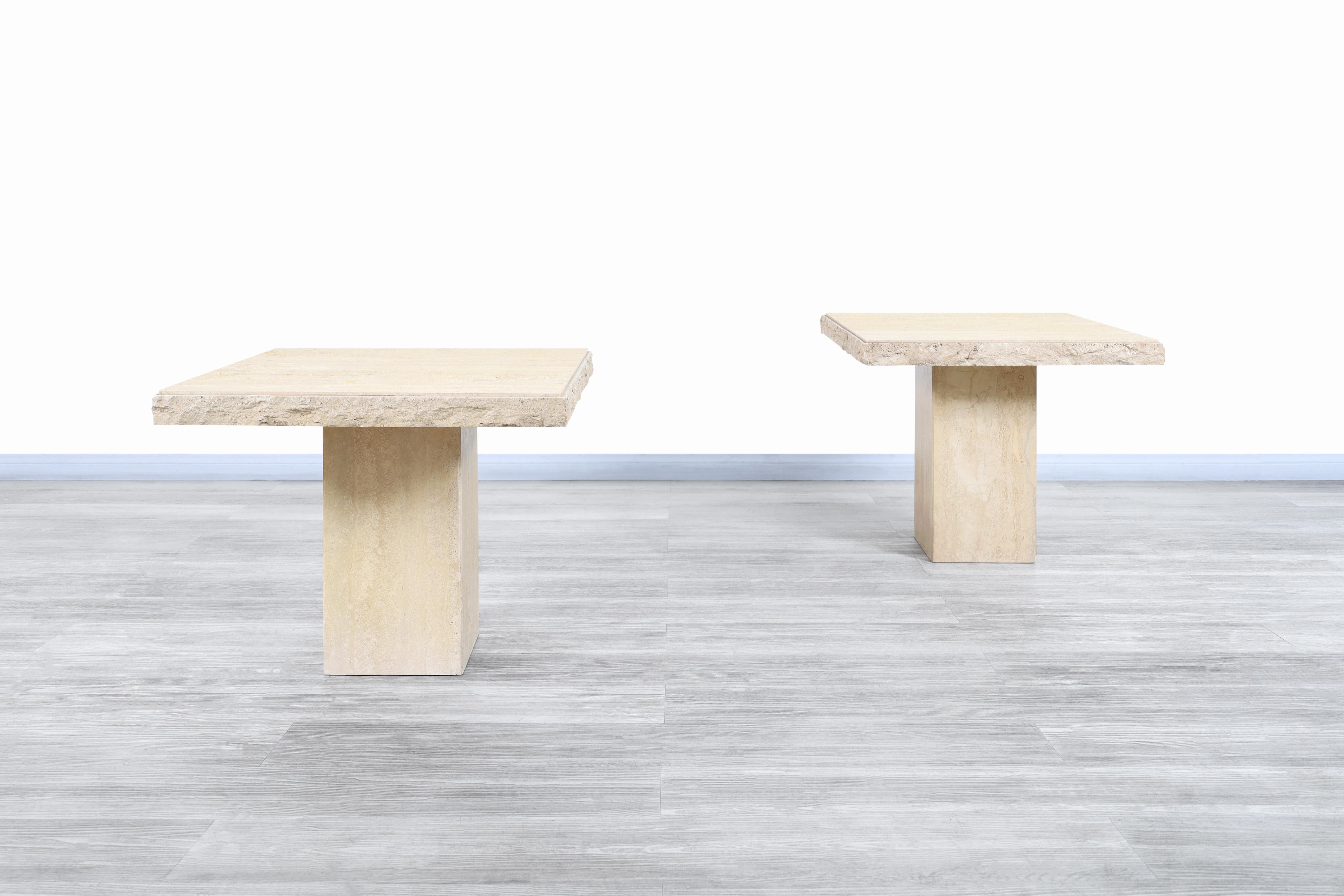 Fantastic vintage Italian live edge travertine side tables designed and manufactured in Italy, circa 1970s. The combination of the natural minerals that make up the travertine stone flows beautifully through the entire table. The tables feature a