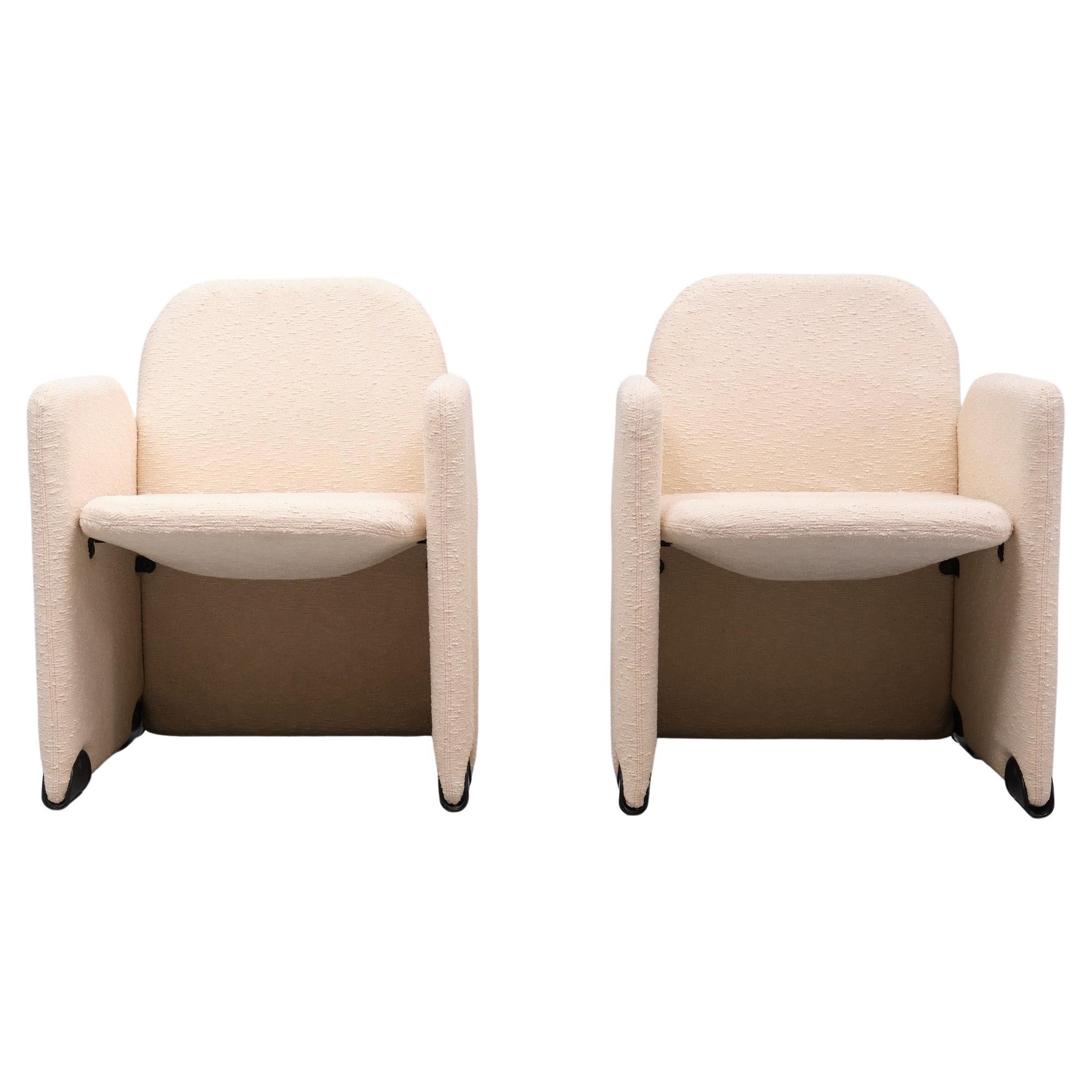Beautiful curves  on these vintage 70's designer Italian chairs . Designed by Ammannati and Vitelli for Brunati.  Original Ivory color  boucle fabric with contrasting signed black plastic footers. In good vintage condition. 