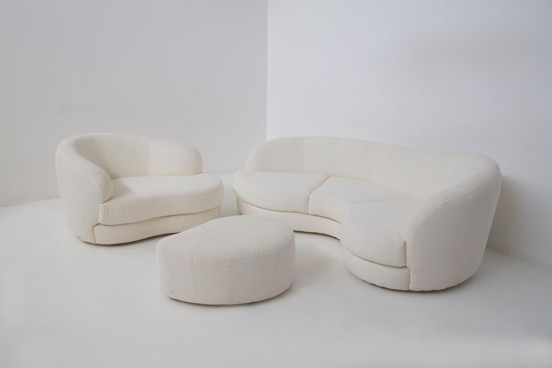 Allow me to introduce you to a truly exquisite vintage Italian lounge set from the 1950s, a harmonious trio consisting of a sofa, an armchair, and an ottoman, all elegantly adorned in lustrous white bouclé.

This set is a testament to the perfect