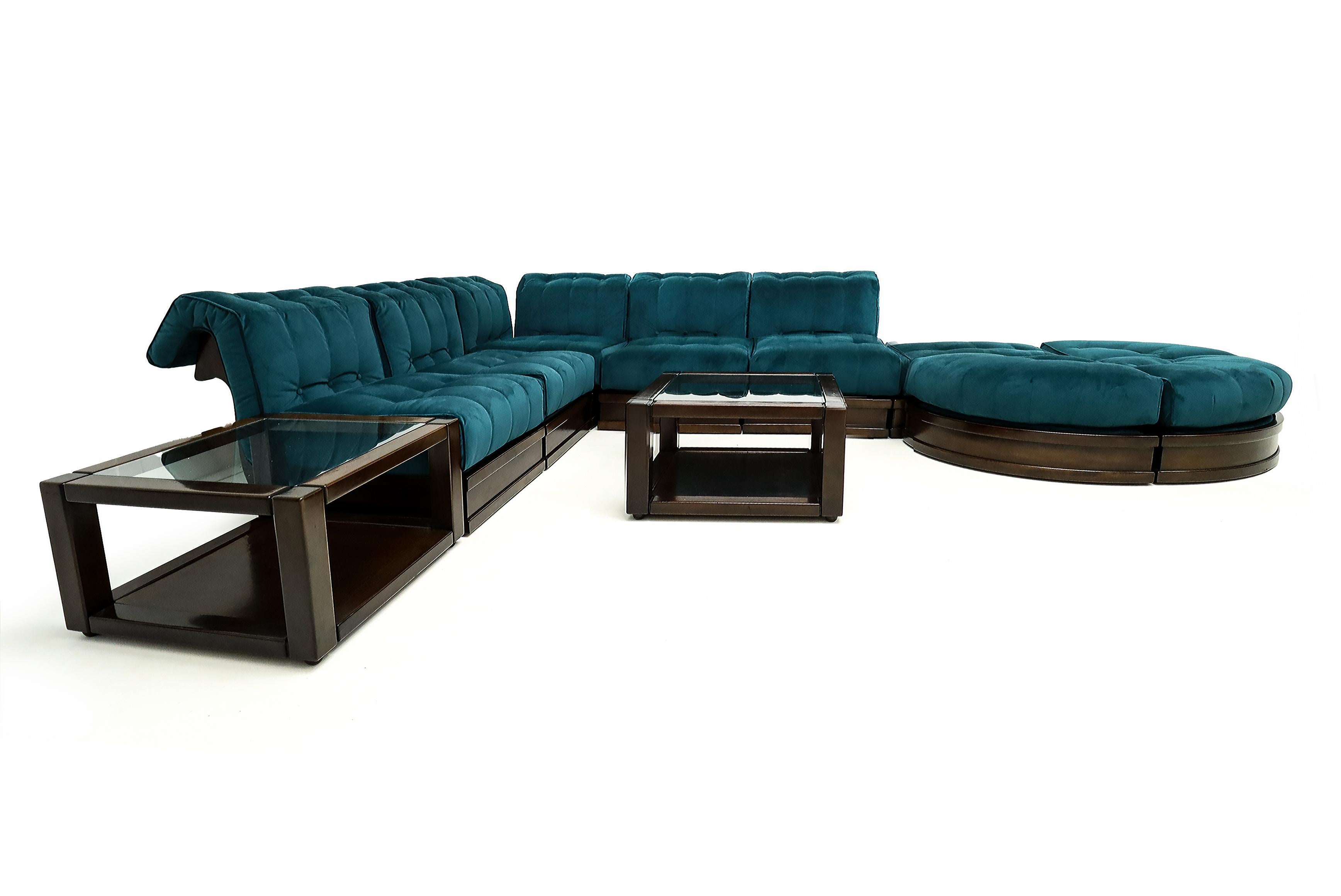 Newly upholstered vintage Italian 1960’s Luciano Frigerio 9 piece solid dark stained Beech and Kingfisher Blue Velvet modular corner Sofa with two coffee tables.

Designed in 1966 by Luciano Frigerio for specialist design manufacturers Di Desio, the