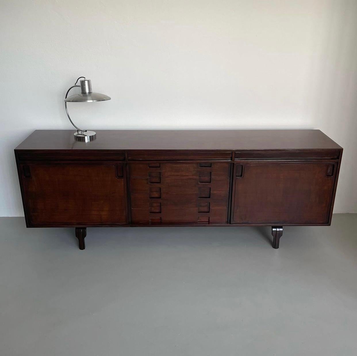 Offered here is a rare, well-executed and extremely interesting sideboard made by Saporiti. Word of mouth attributes it to Luciano Magri, a lesser known Italian designer from the 1950s and 60s. It is particularly appealing because of its refined