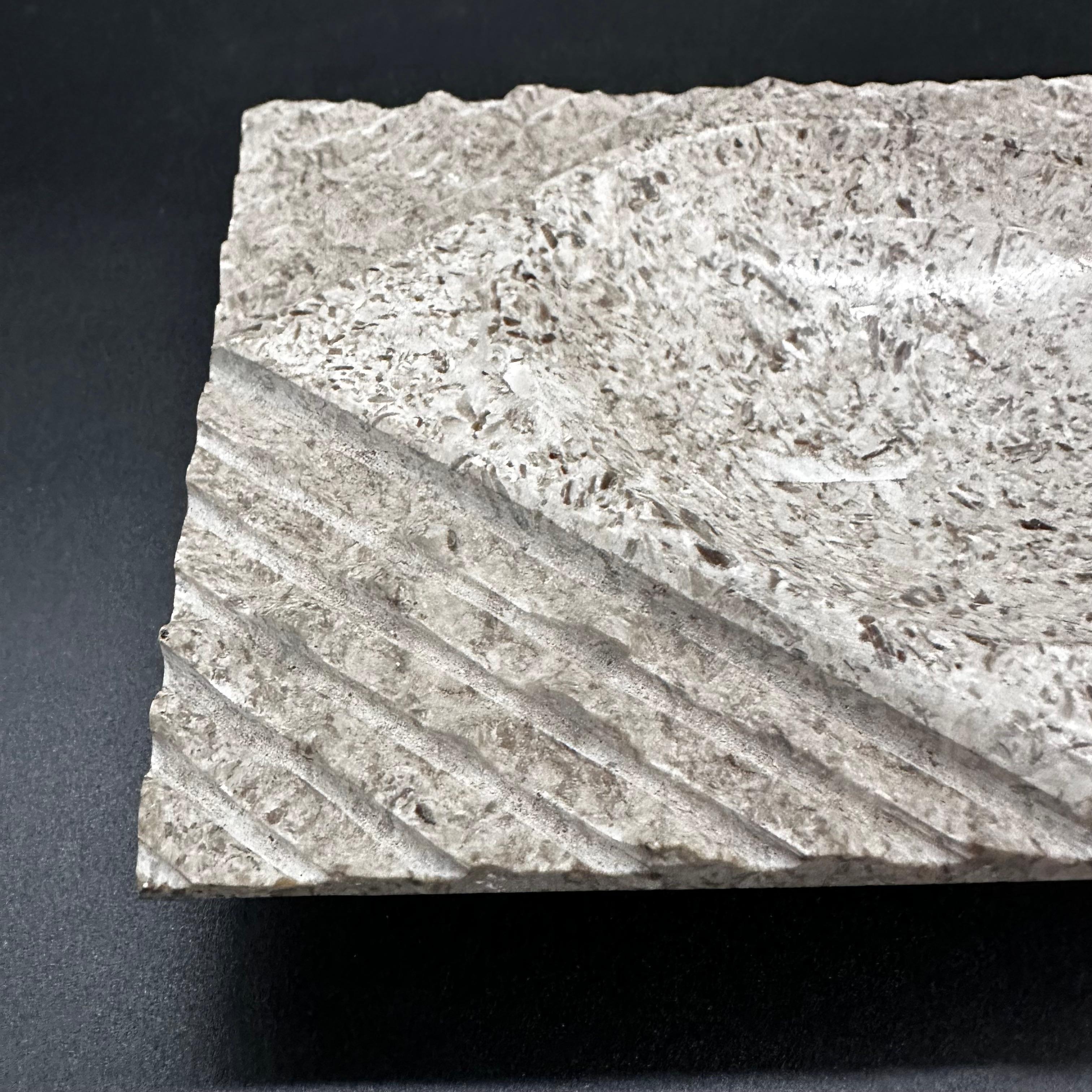A vintage Italian marble ashtray from the 1960s typically features elegant, sleek lines and exquisite craftsmanship. Made from high-quality marble, it showcases the beauty of natural stone with its unique veining and polished finish.


