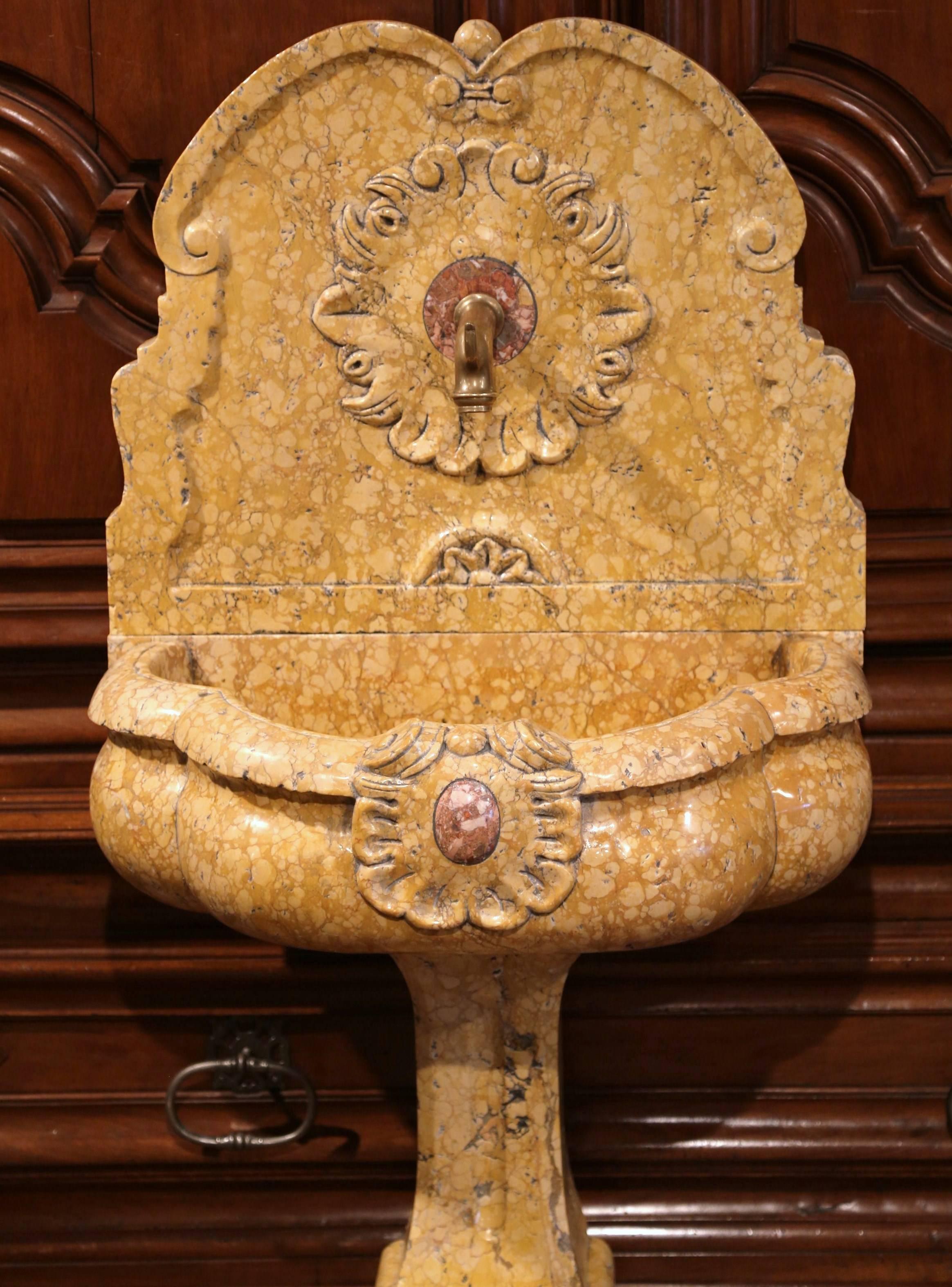 Elegant Italian marble fountain from Italy; carved circa 2000, the colorful fountain is made of three parts, a base, a basin and a back splash with brass spout. A great addition for a patio, a green room, or to convert into a powder room