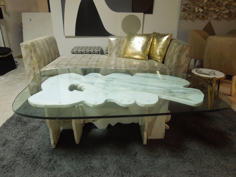 A 20th century master’s coffee table designed by renowned Artist/Sculptor Abbott Pattison, (1916-1999). handcut puzzle pieces of Carrara marble imported by the artist in the early 1960s from Florence, Italy, interlock to form the intricate bases in