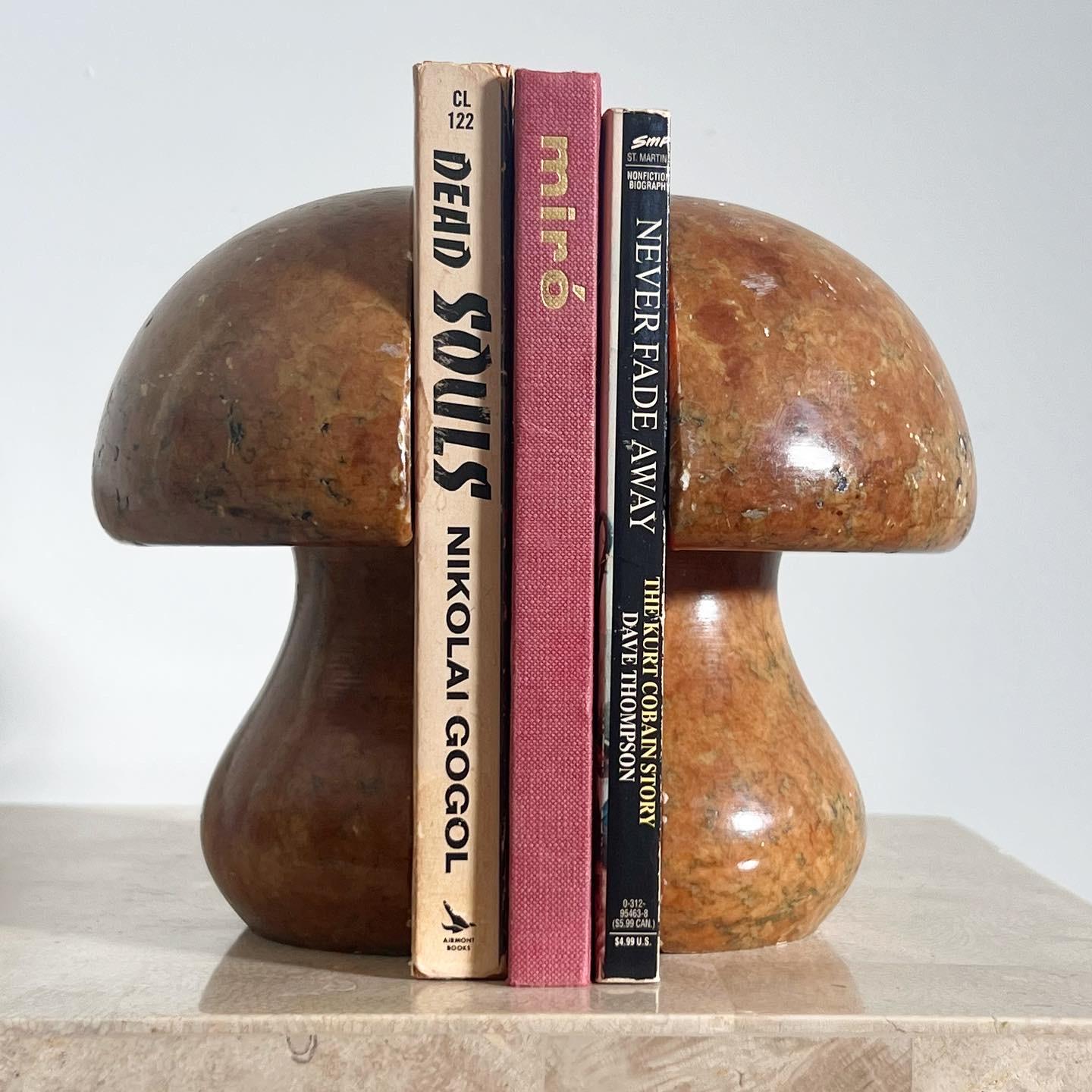 A pair of vintage Italian marble mushroom bookends, hand-carved in Italy, 1960s. Tones of ochre, rust, and olive. Minor signs of wear n tear. Pick up in central West Los Angeles or we ship worldwide. 
As a unit: 5.5” W x 6” D x 6.5” H