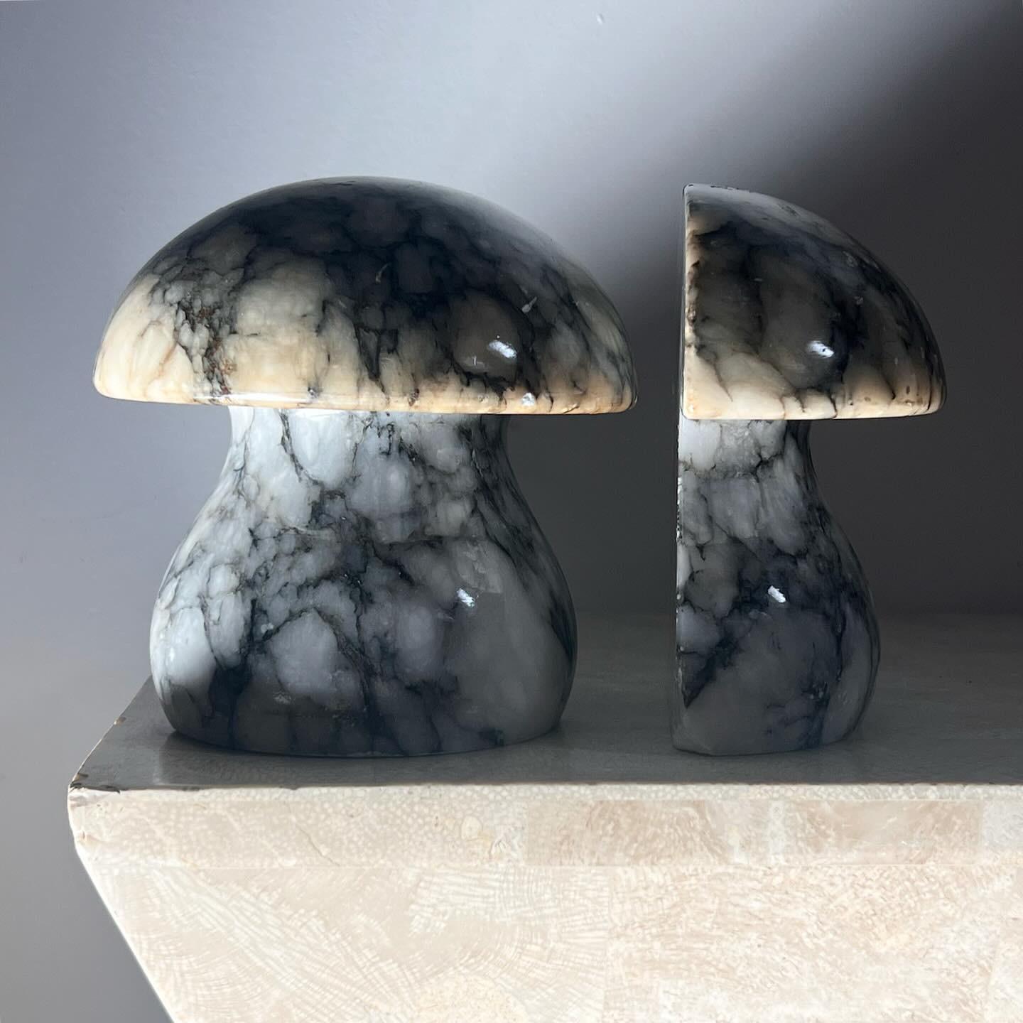 SHROOM SEASON: a pair of vintage Italian marble mushroom bookends by Noymer, circa 1960. Tones of salt and slate. Some wear including losses; please see photos! Pick up in LA or we ship worldwide.
As a pair: 6” W x 5.75” D x 6” H