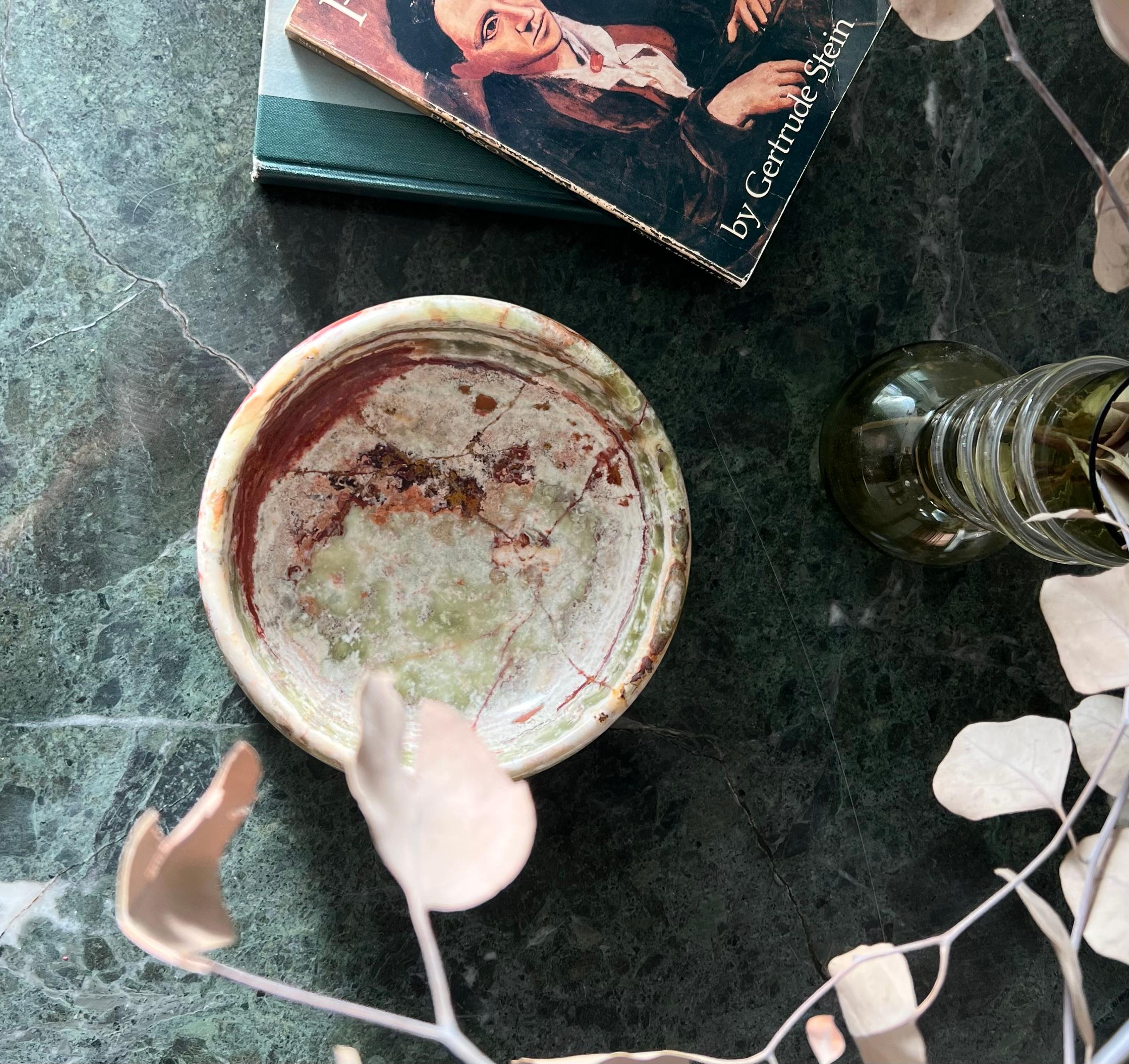 A large marble onyx dish in tones of pistachio, rust, and foam, circa 1960s. Hand-carved in Italy. Could function as a small fruit bowl or a large catchall. Fabulous condition with minor signs of age. Pick up in central west Los Angeles or worldwide