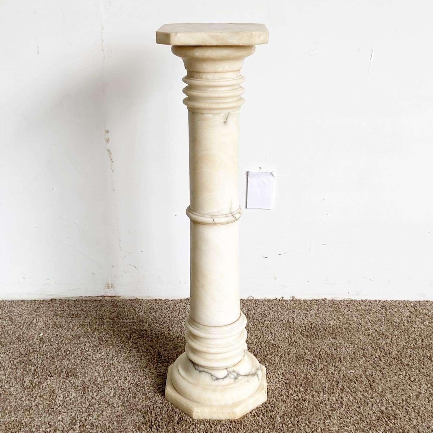 Amazing vintage Italian marble pedestal. Features an ornate shape.
