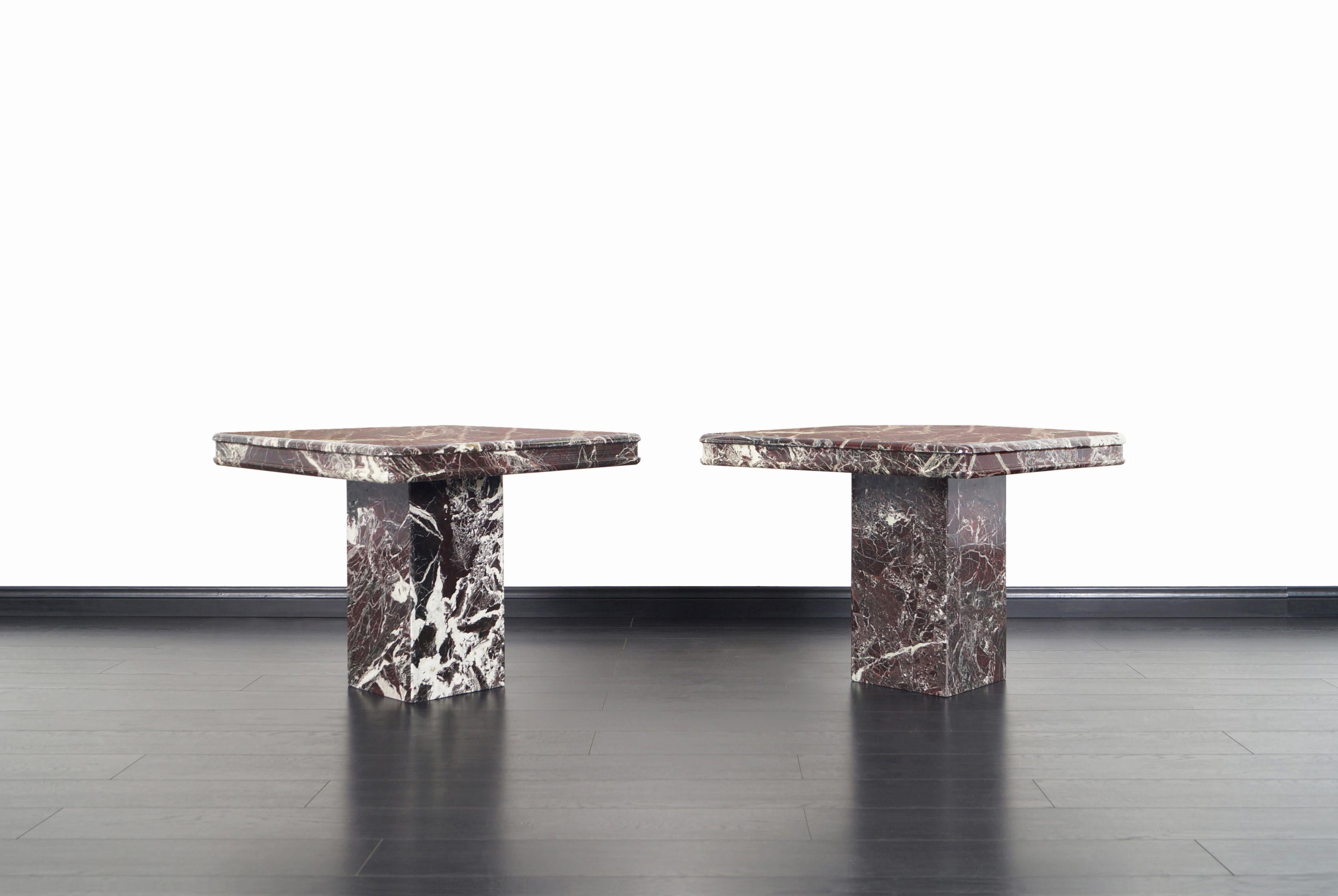 Pair of beautiful vintage marble side tables / end tables manufactured in Italy, circa 1980s. Simple and Minimalist style along the rich veining and color combination distinguishes these tables as an element of the highest quality. The tables have a