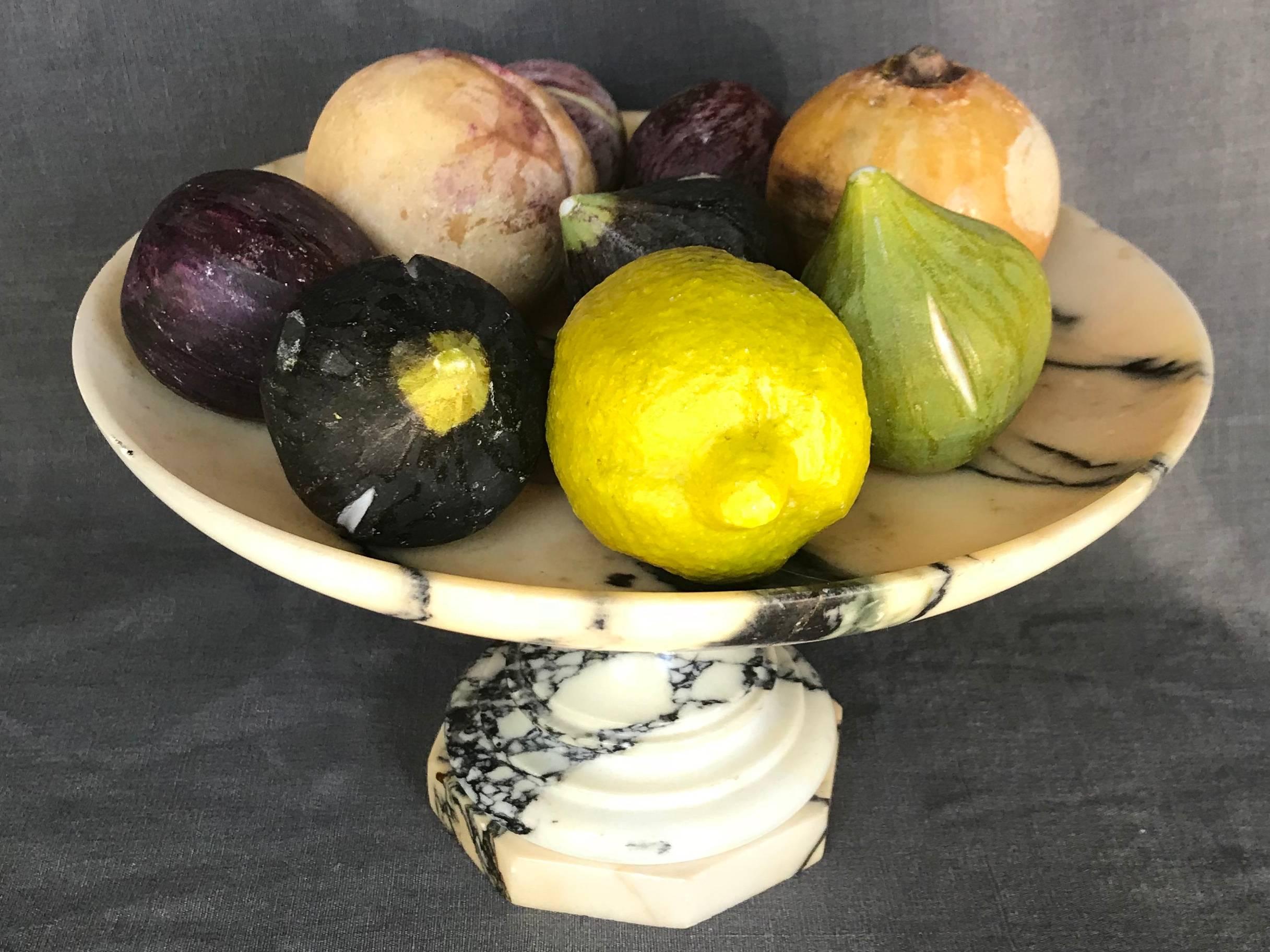 Vintage Italian marble tazza with carved fruit. Carved marble footed tazza with shallow bowl holding marvellous lifelike carved stone fruit including figs, plums, peach, persimmon and a lemon, Italy, circa 1930.
Dimensions: Cake stand 10.75