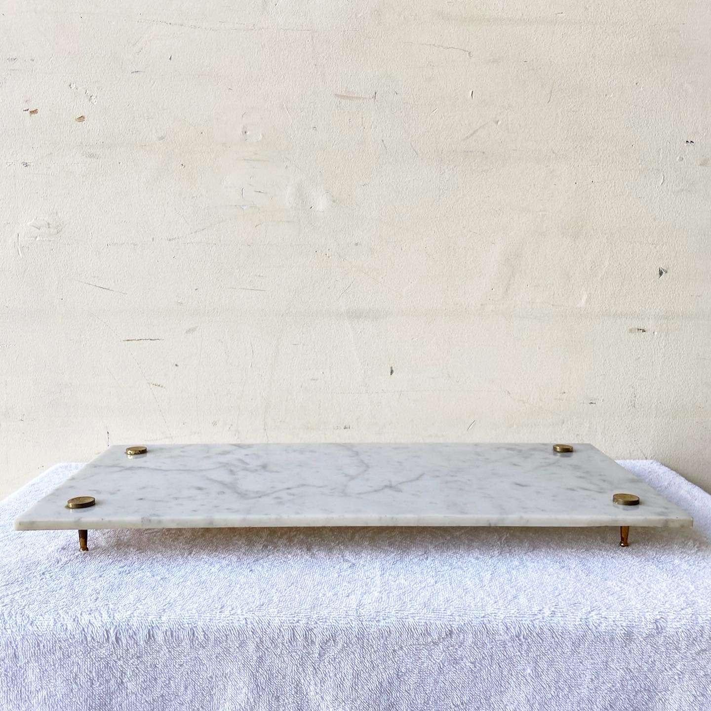 Amazing vintage Italian marble vanity tray. Features 4 little golden legs with a rectangular tray.
