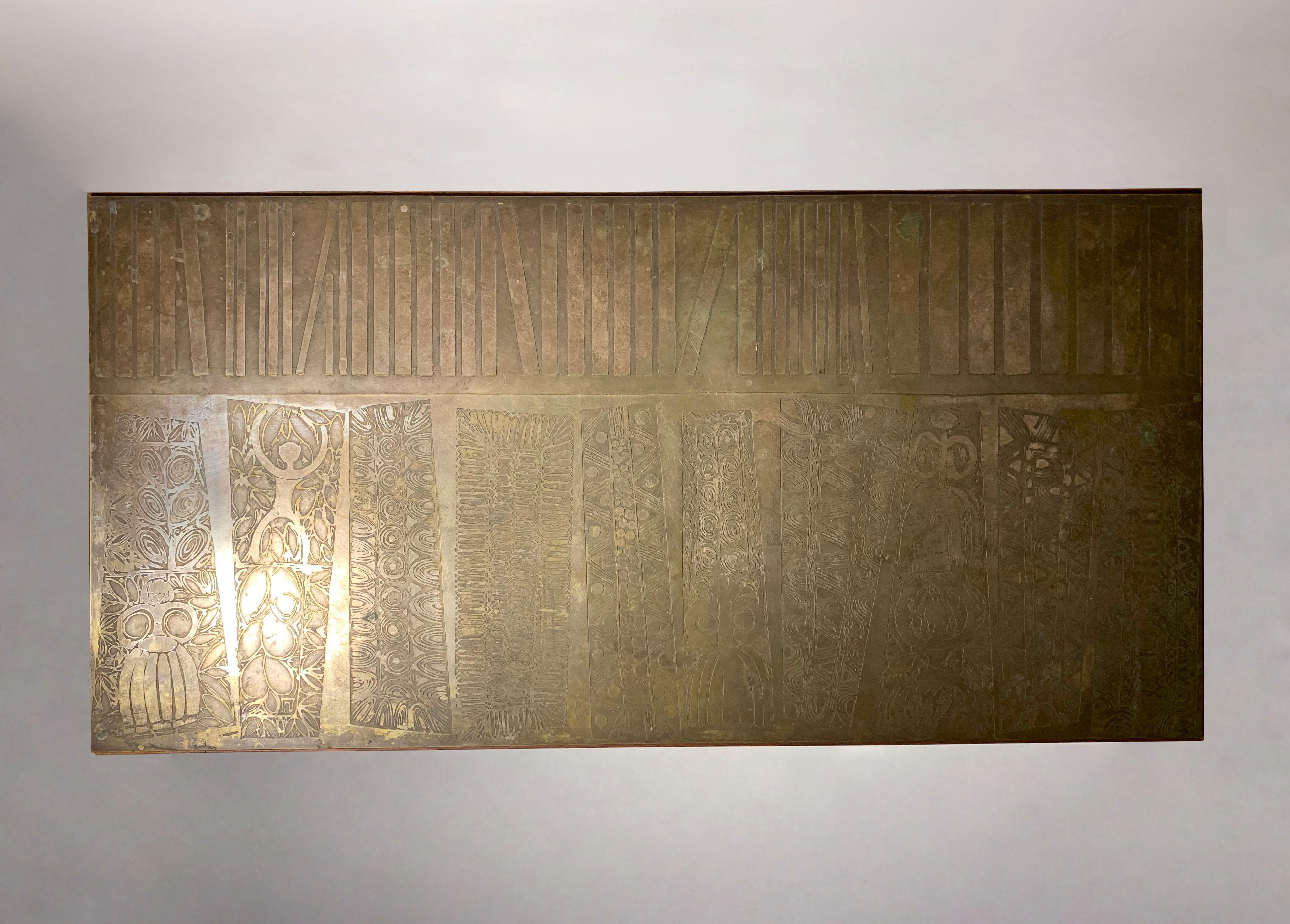 This coffee table is made etched brass and features varnished metal that mounts to a modern Mahogany structure base.  Etching is from Italy by Artist G. Urso. 

As shown in last photo the original glue has separated. I have it left it as is in the