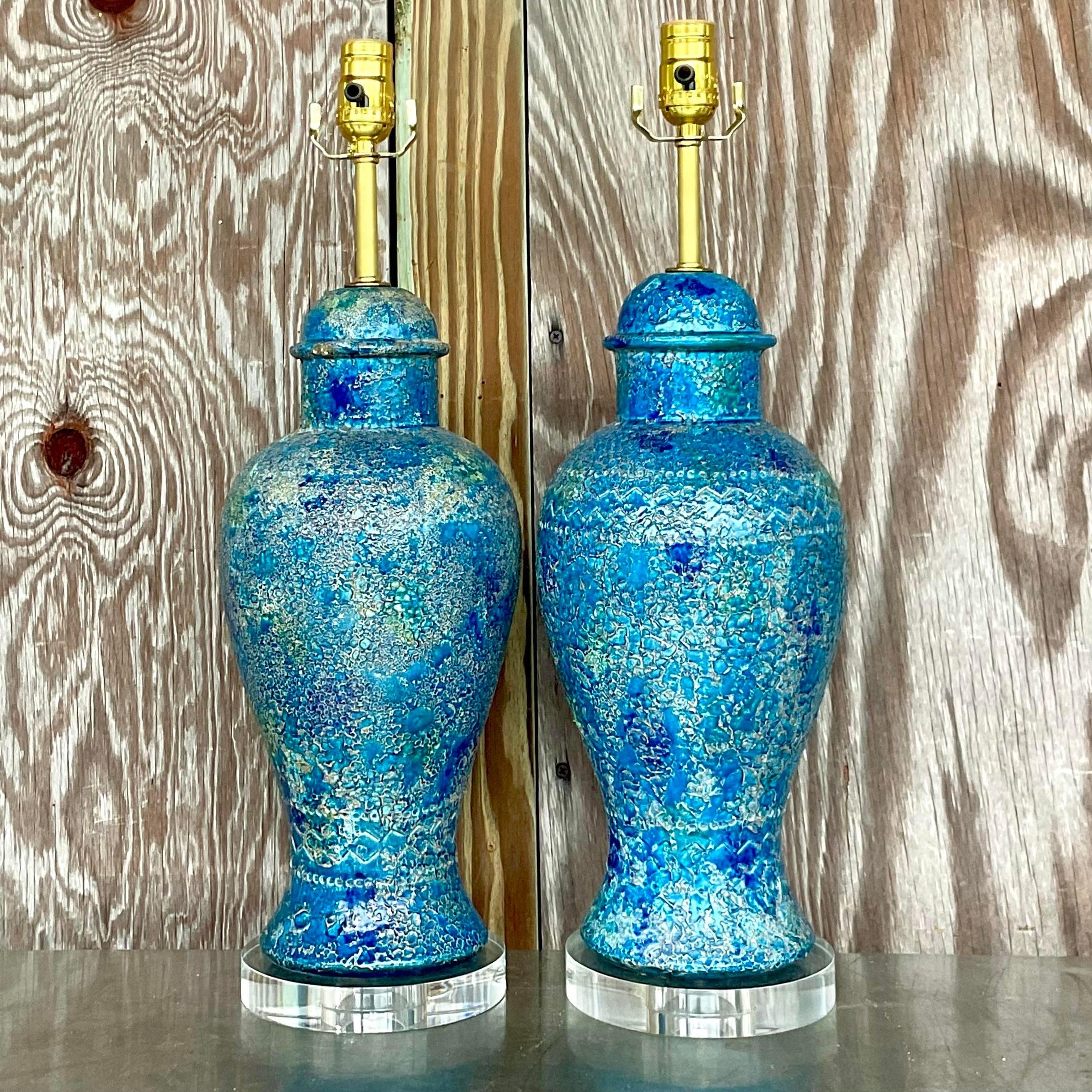 A fabulous pair of vintage Italian MCM table lamps. Made by the iconic Bitossi group for Raymor and signed on the bottom. Beautiful blue glazed ceramic with a lava finish. Fully restored with all new wiring, hardware and lucite plinths. Acquired