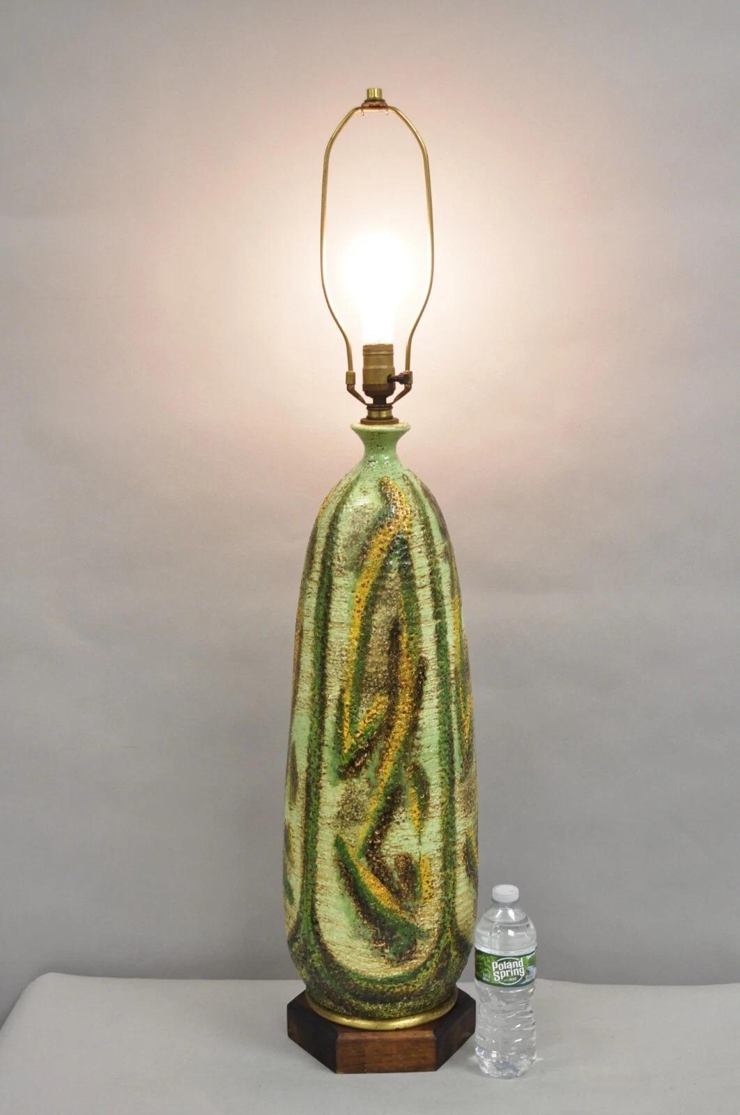 Vintage Italian Mid Century Modern Green Pottery Glazed Ceramic Tall Table Lamp on Wooden Base. Circa Mid 20th Century. Measurements: 40