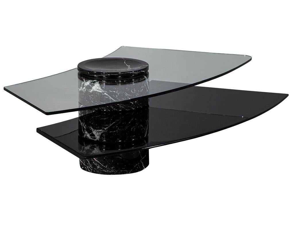 Vintage Italian Mid-Century Modern stone and glass cocktail coffee table. Vintage Italian stone, black lacquer, and glass self-winding cocktail table with two levels.

Price includes complimentary curb side delivery to the continental
